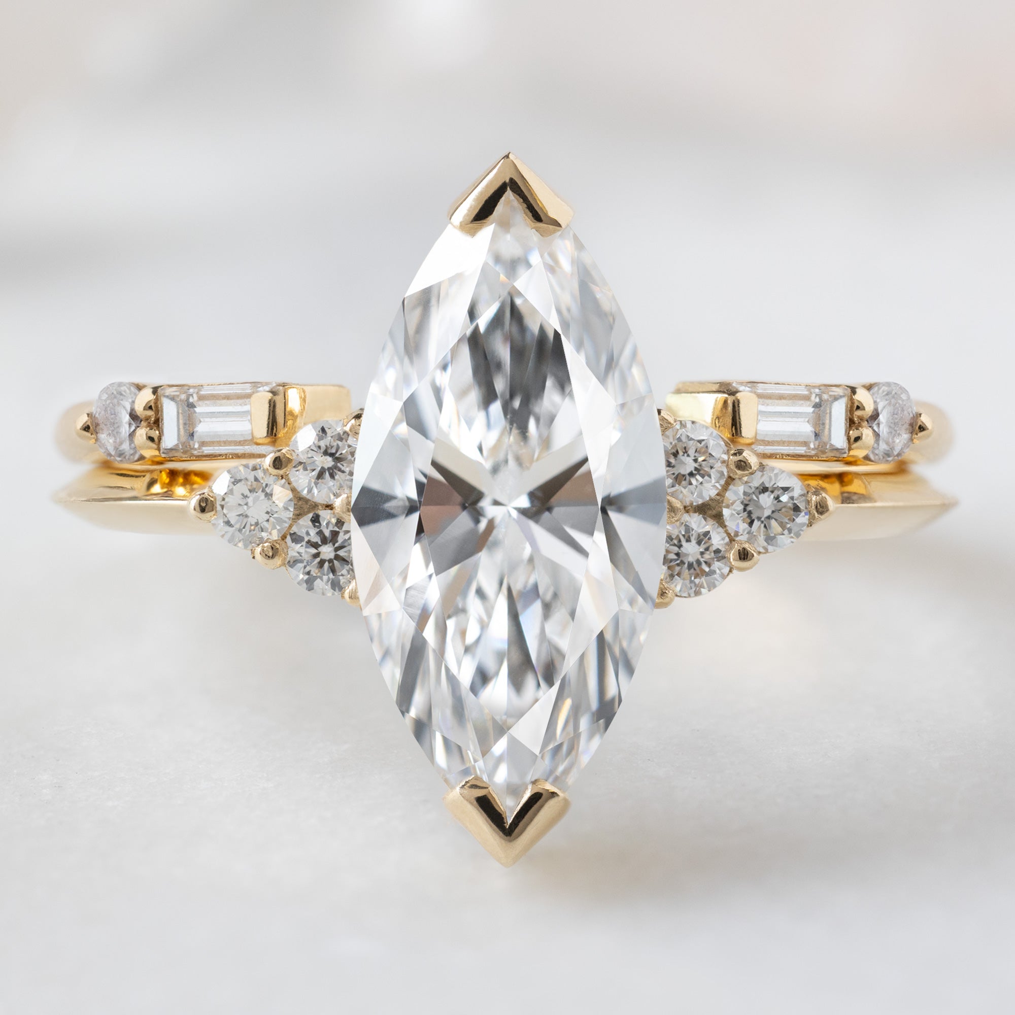The Ivy Ring with a 1.64ct Marquise Lab Grown White Diamond in 14K Yellow Gold Stacked with the Luxe Open Cuff White Baguette Diamond Stacking Band