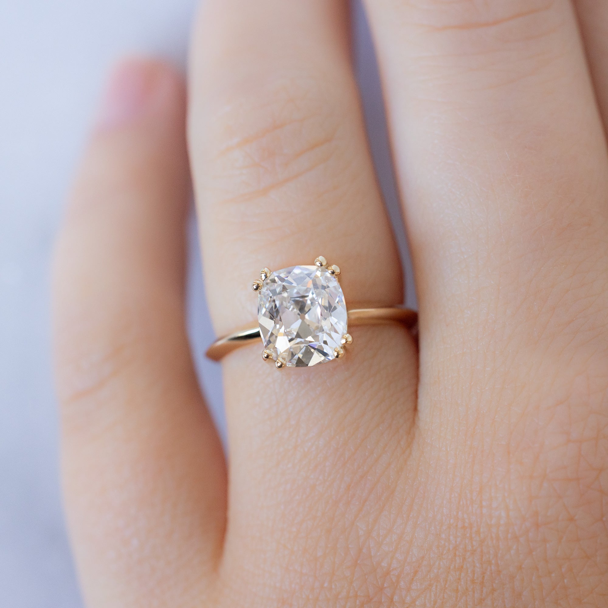 The Bryn Ring with a 2.32ct Old Mine Cut White Diamond in 14K Yellow Gold on Model