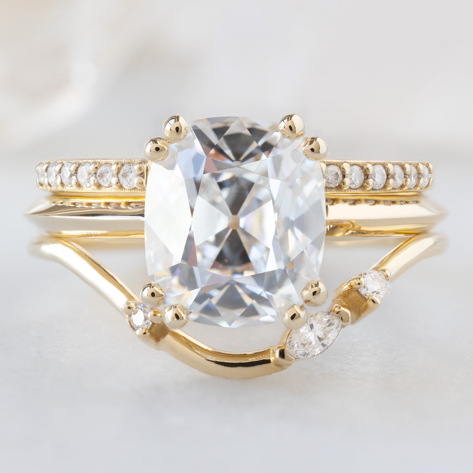 buy:the-white-diamond-pave-wedding-band-14k-or-18k-yellow-gold,the-bryn-ring-2-32ct-old-mine-cut-lab-grown-white-diamond-in-14k-yellow-gold,asymmetrical-marquise-diamond-arc-stacking-band-in-14k-yellow-gold