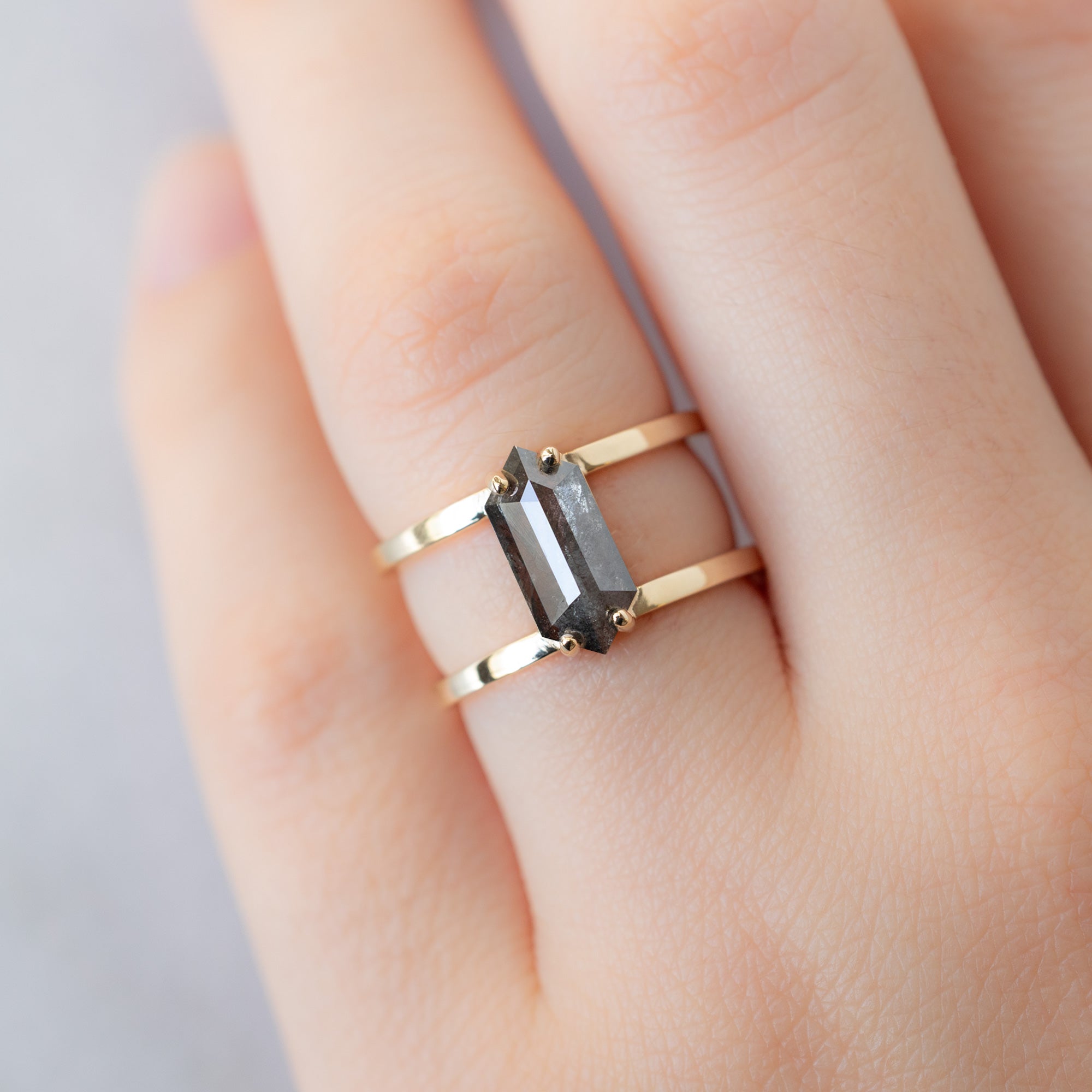 The Poppy Ring with a 1.57ct Hexagon Salt and Pepper Diamond in 14K Yellow Gold on Model