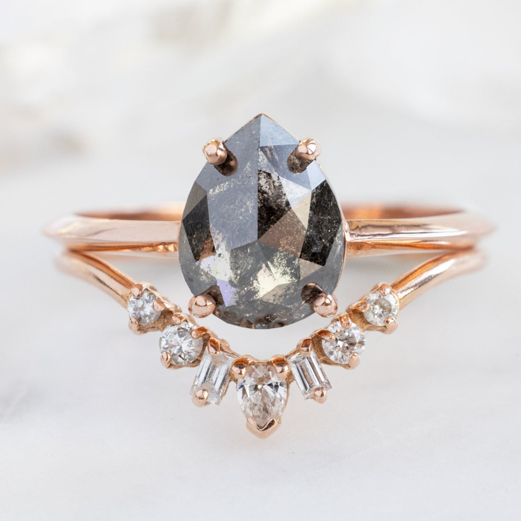 The Bryn Ring with a 1.38ct Pear Black Diamond in 14K Rose Gold Stacked with the Geometric White Diamond Sunburst Stacking Band