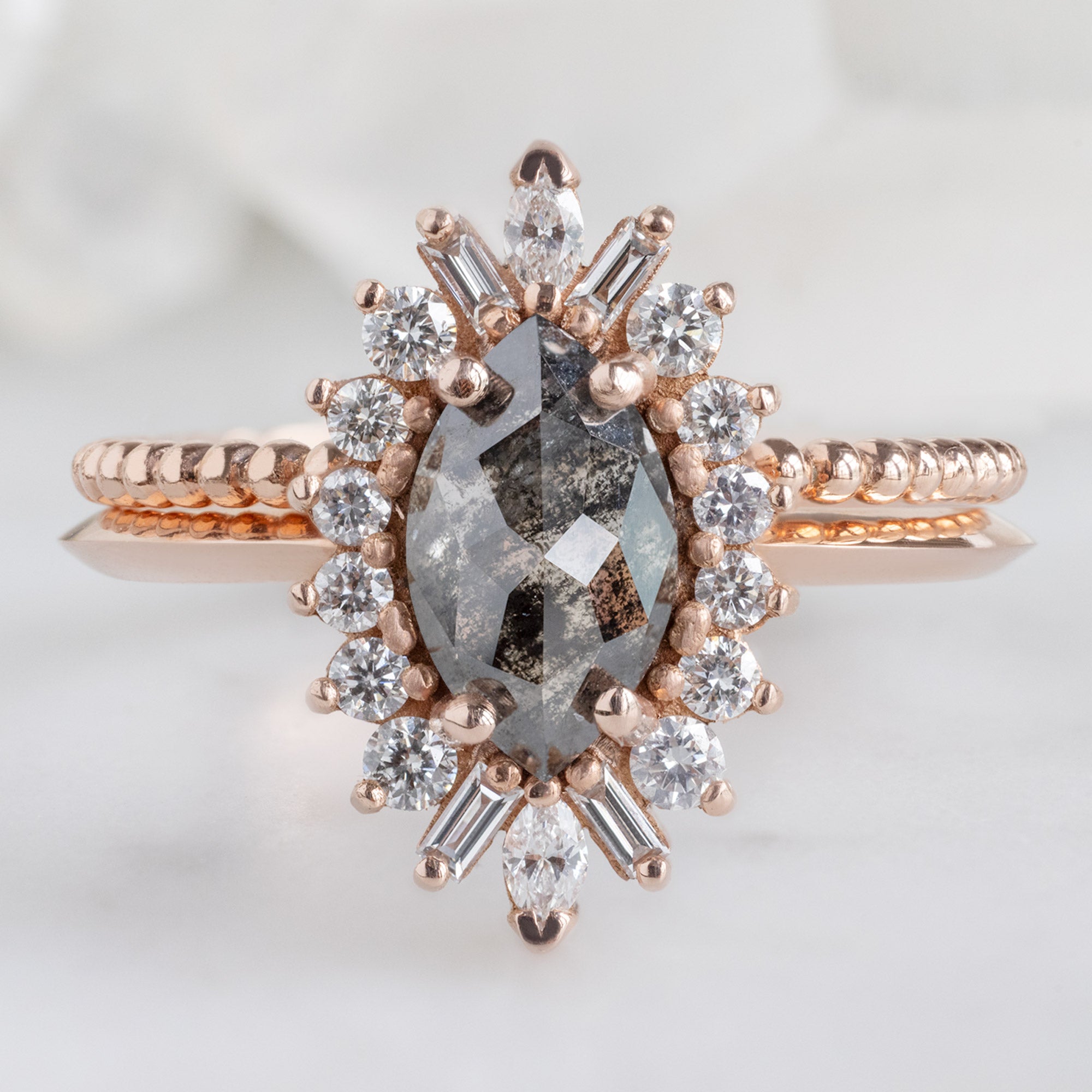 The Camellia Ring with a 0.94ct Marquise Cut Black Diamond in 14K Rose Gold Stacked with the Beaded Stacking Rin