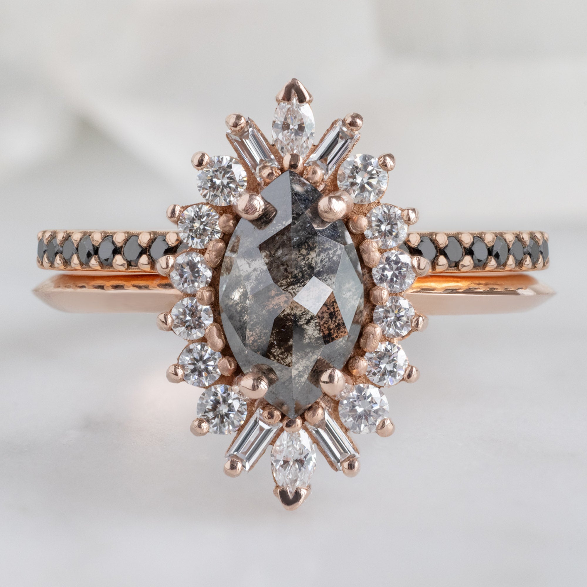 The Camellia Ring with a 0.94ct Marquise Cut Black Diamond in 14K Rose Gold Stacked with the Black Pavé Diamond Stacking Ring