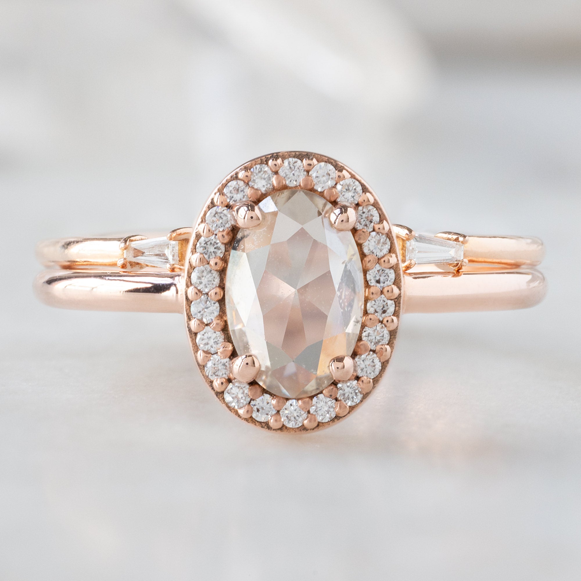 The Dahlia Ring with a 0.87ct Oval Pink Diamond with Open Cuff White Diamond Baguette Stacking Ring