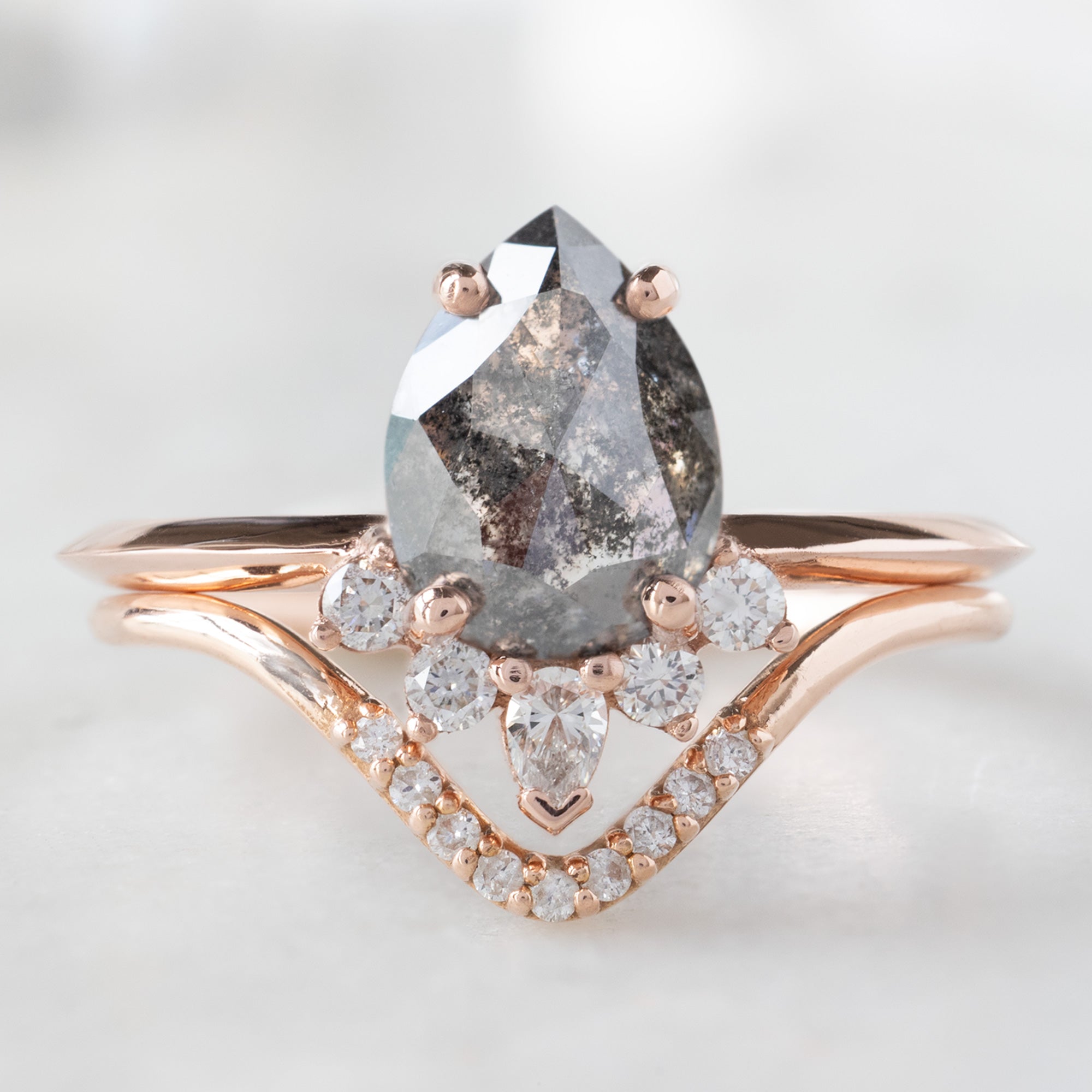The Aster Ring with a 1.41ct Pear Black Diamond in 14K Rose Gold Stacked with the White Diamond Pavé Peak Stacking Band