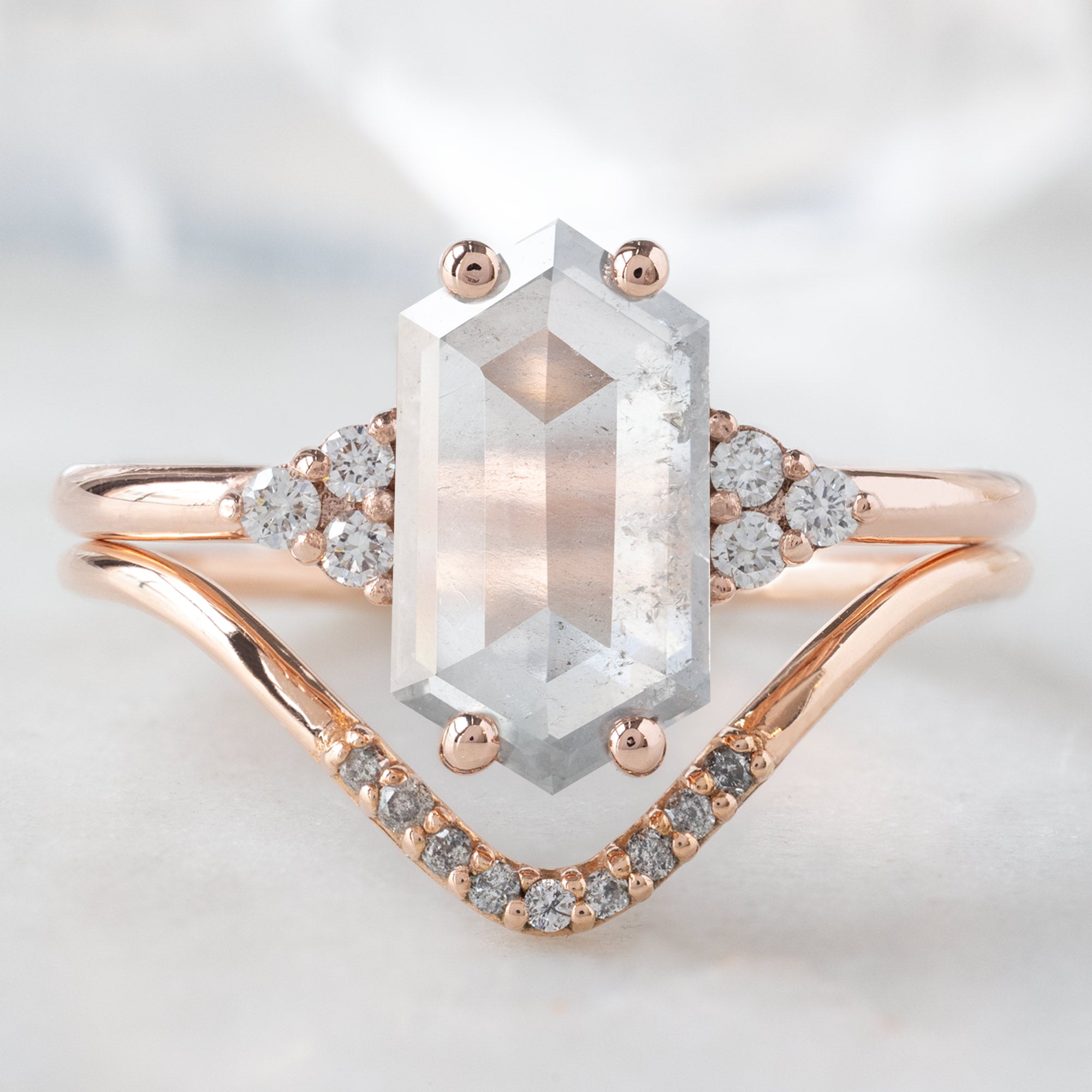 The Ivy Ring with a 1.55ct Hexagon Icy White Diamond in 14K Rose Gold Stacked with the Sale and Pepper Diamond Pavé Peak Stacking Band