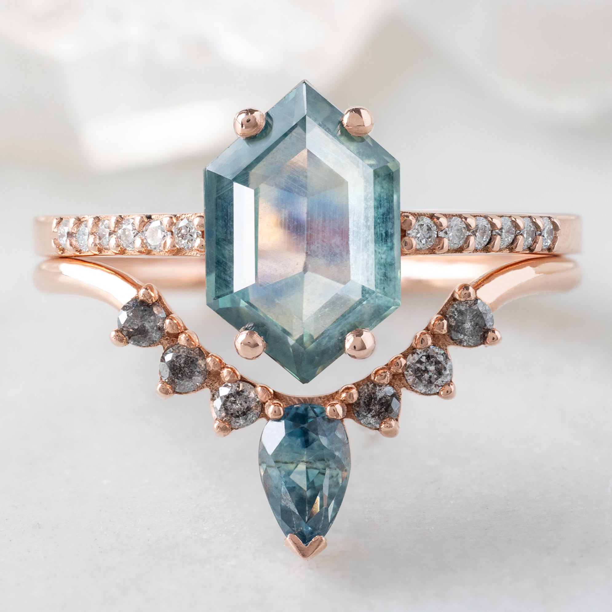The Willow Ring with a 1.86ct Hexagon Montana Sapphire in 14K Rose Gold Stacked with the Sapphire Sunburst Stacking Band