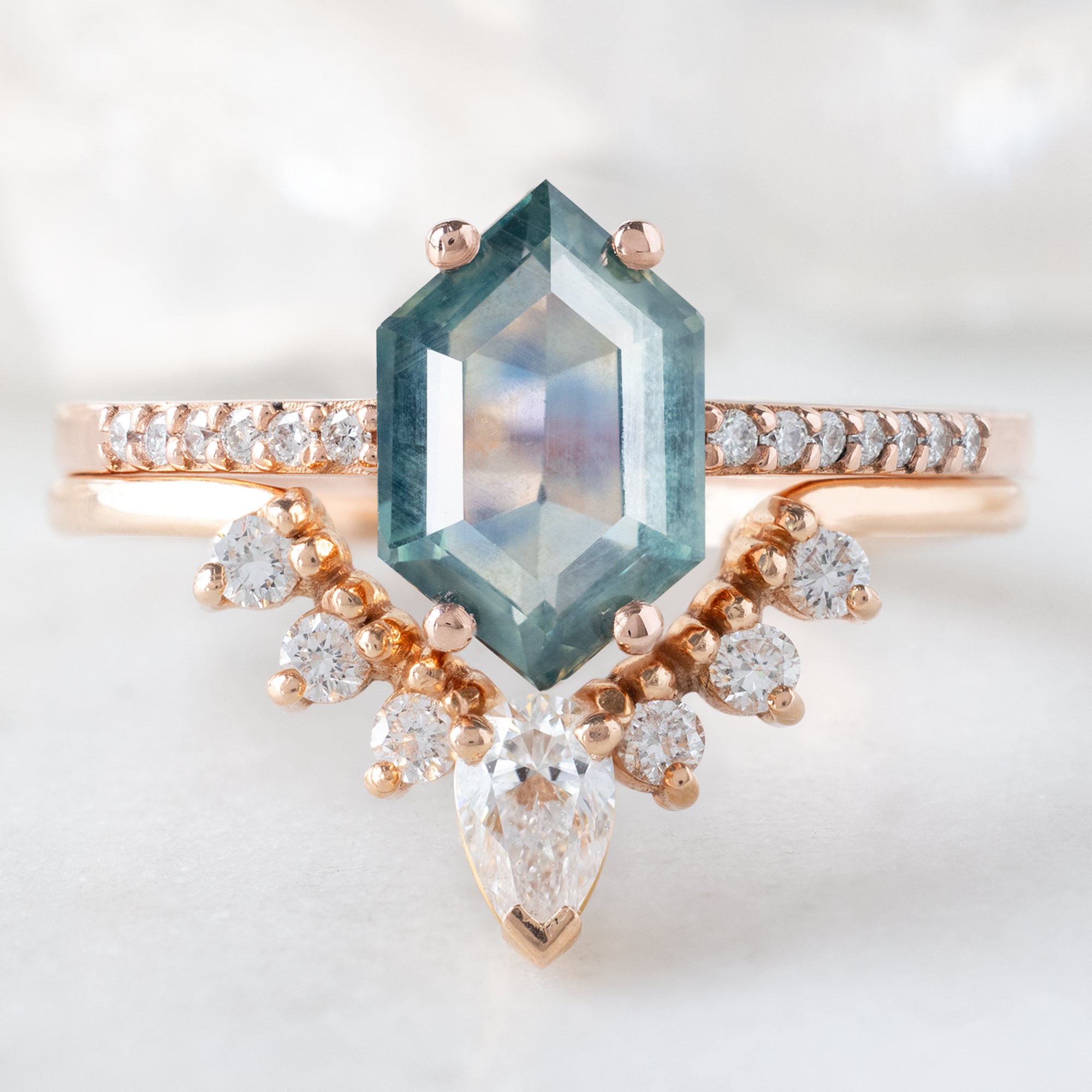 The Willow Ring with a 1.86ct Hexagon Montana Sapphire in 14K Rose Gold Stacked with the White Diamond Sunburst Stacking Band
