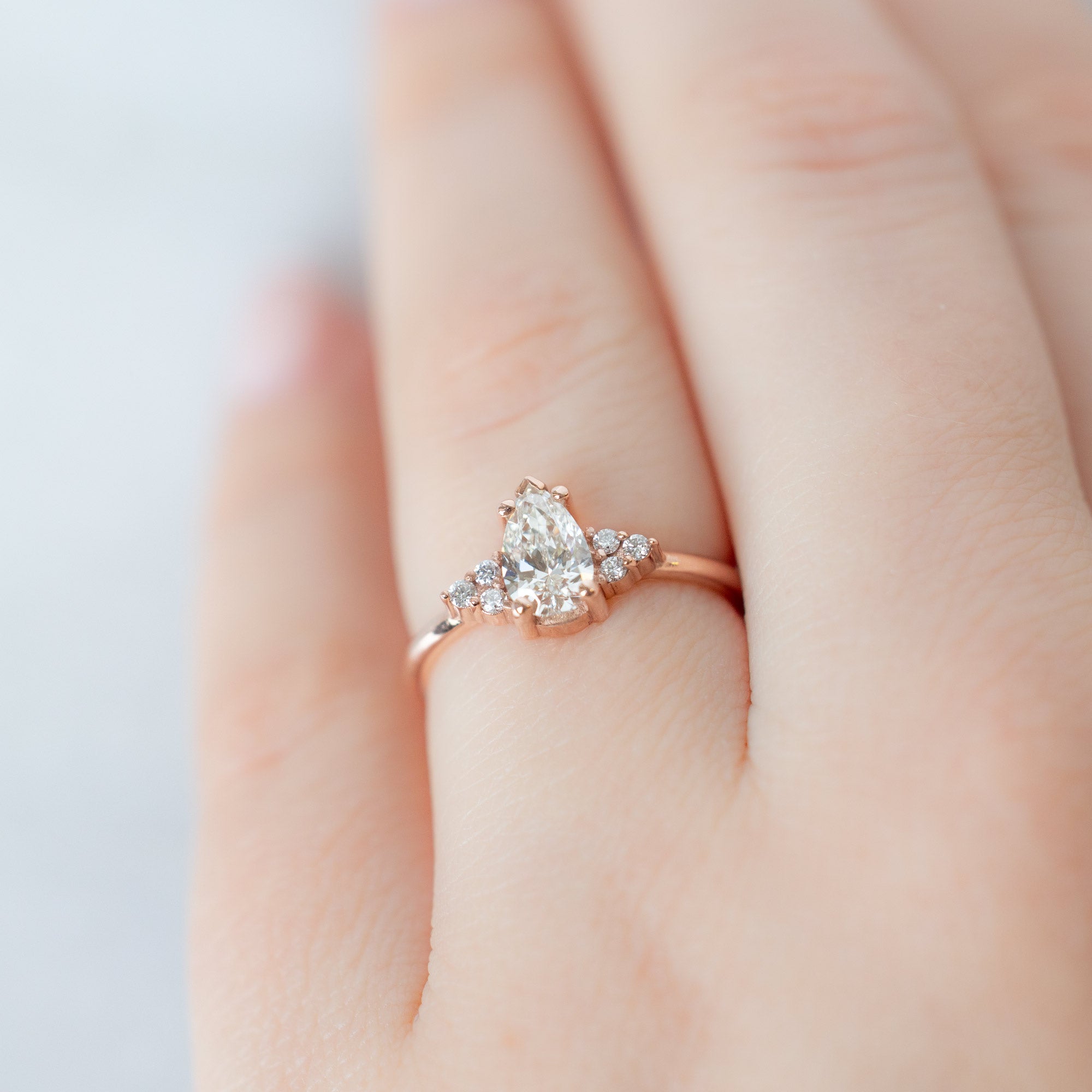 The Ivy Ring with a 0.65ct Pear White Diamond in 14K Rose Gold on Model