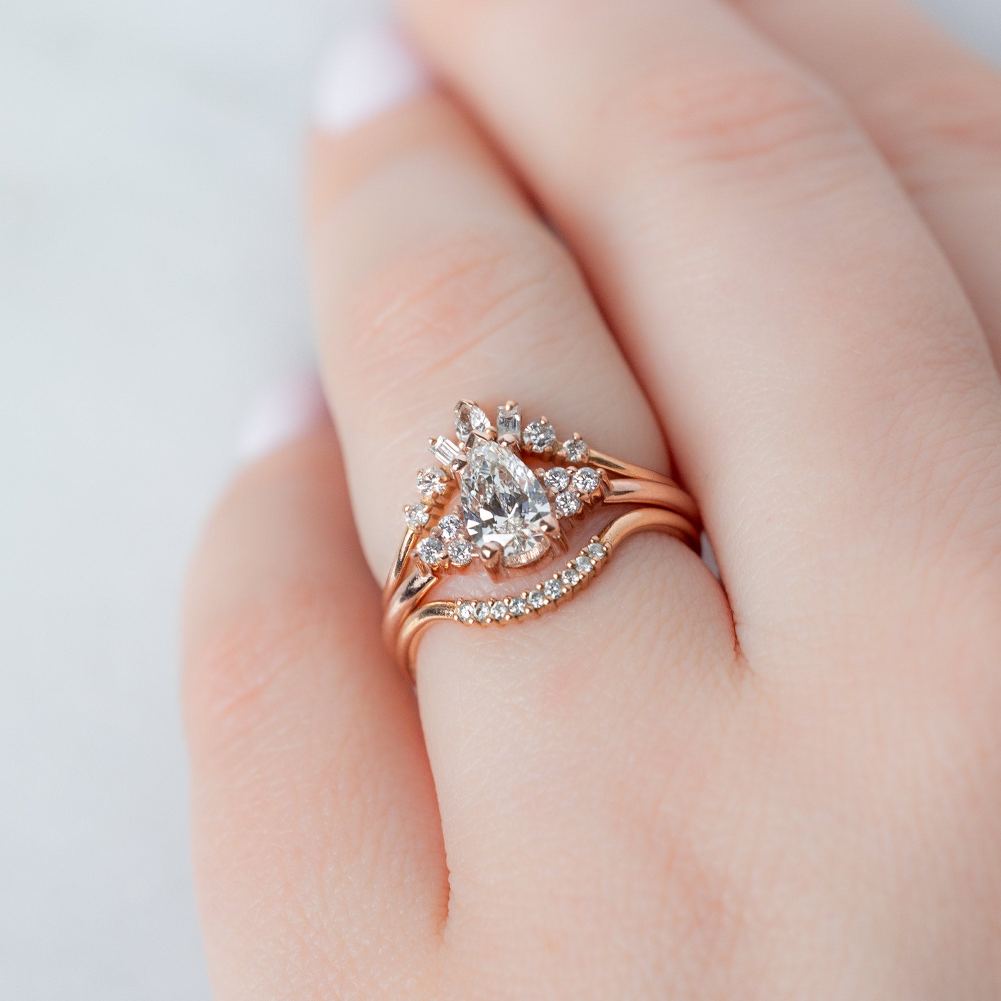 buy:geometric-white-diamond-sunburst-stacking-band-14k-or-18k-yellow-gold,the-ivy-ring-0-65ct-pear-white-diamond-in-14k-rose-gold,white-diamond-pave-arc-stacking-band-14k-or-18k-yellow-gold