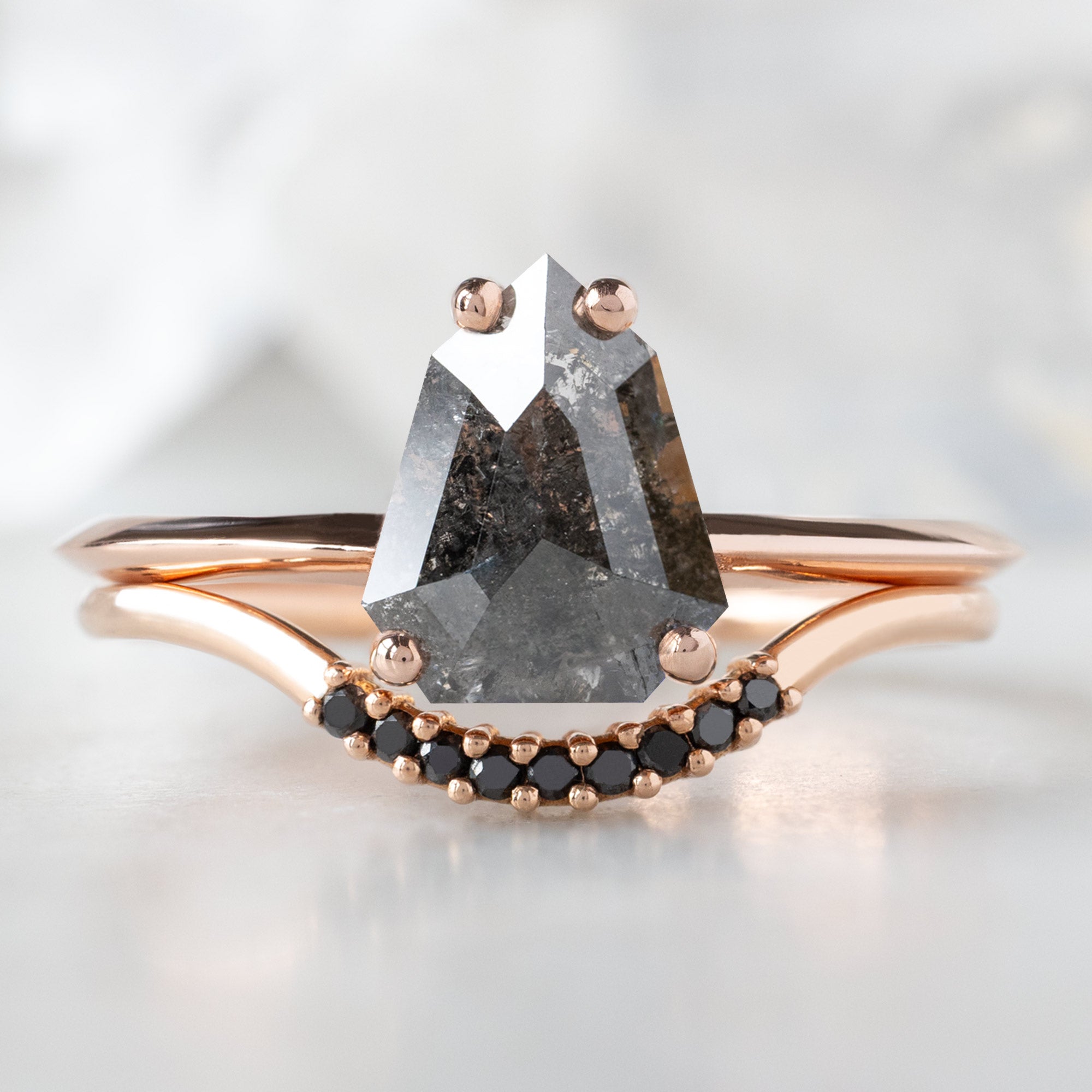 The Bryn Ring with a 1.34ct Geometric Black Diamond in 14K Rose Gold Stacked with the Black Diamond Pavé Stacking Band