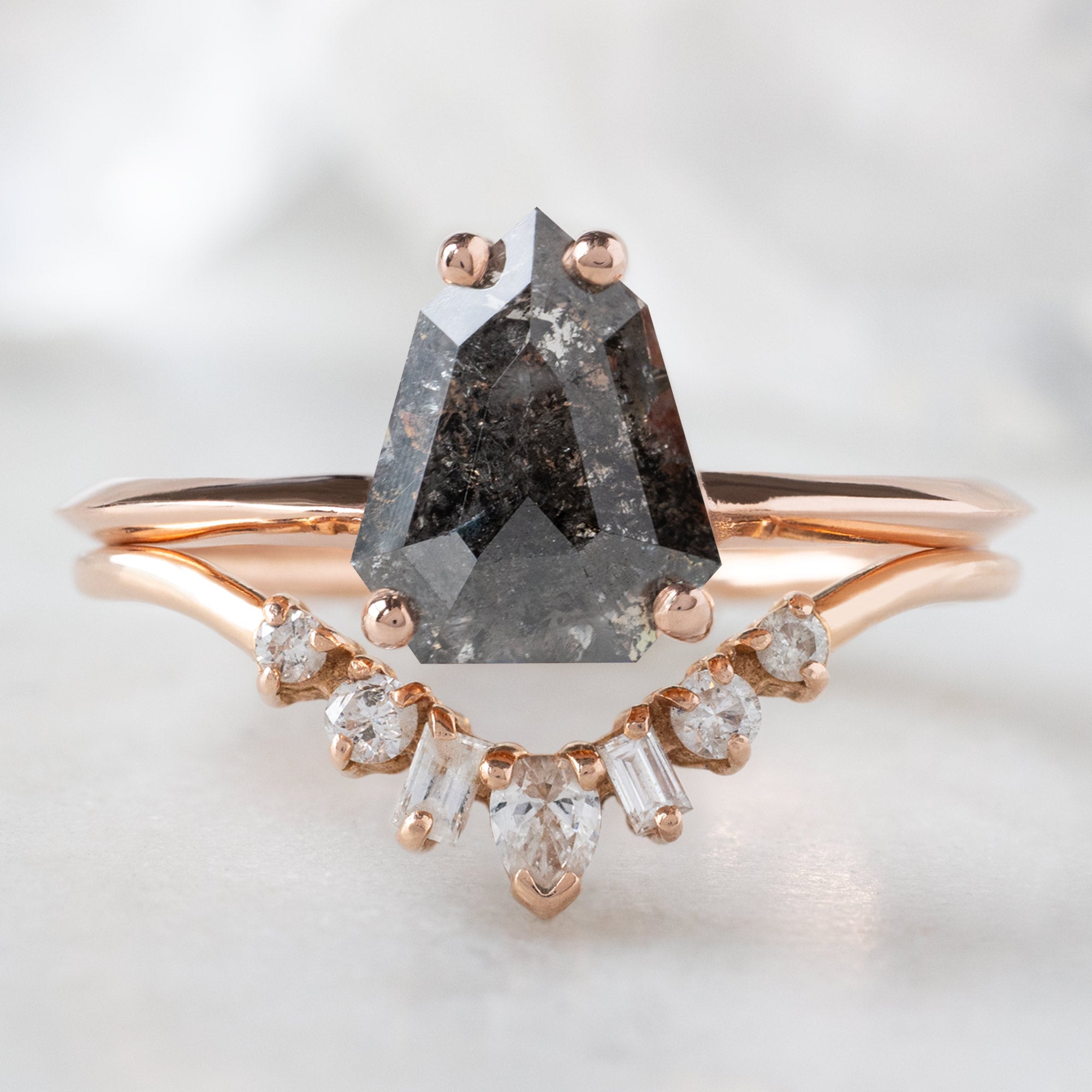 The Bryn Ring with a 1.34ct Geometric Black Diamond in 14K Rose Gold Stacked with the Geometric White Diamond Sunburst Stacking Band