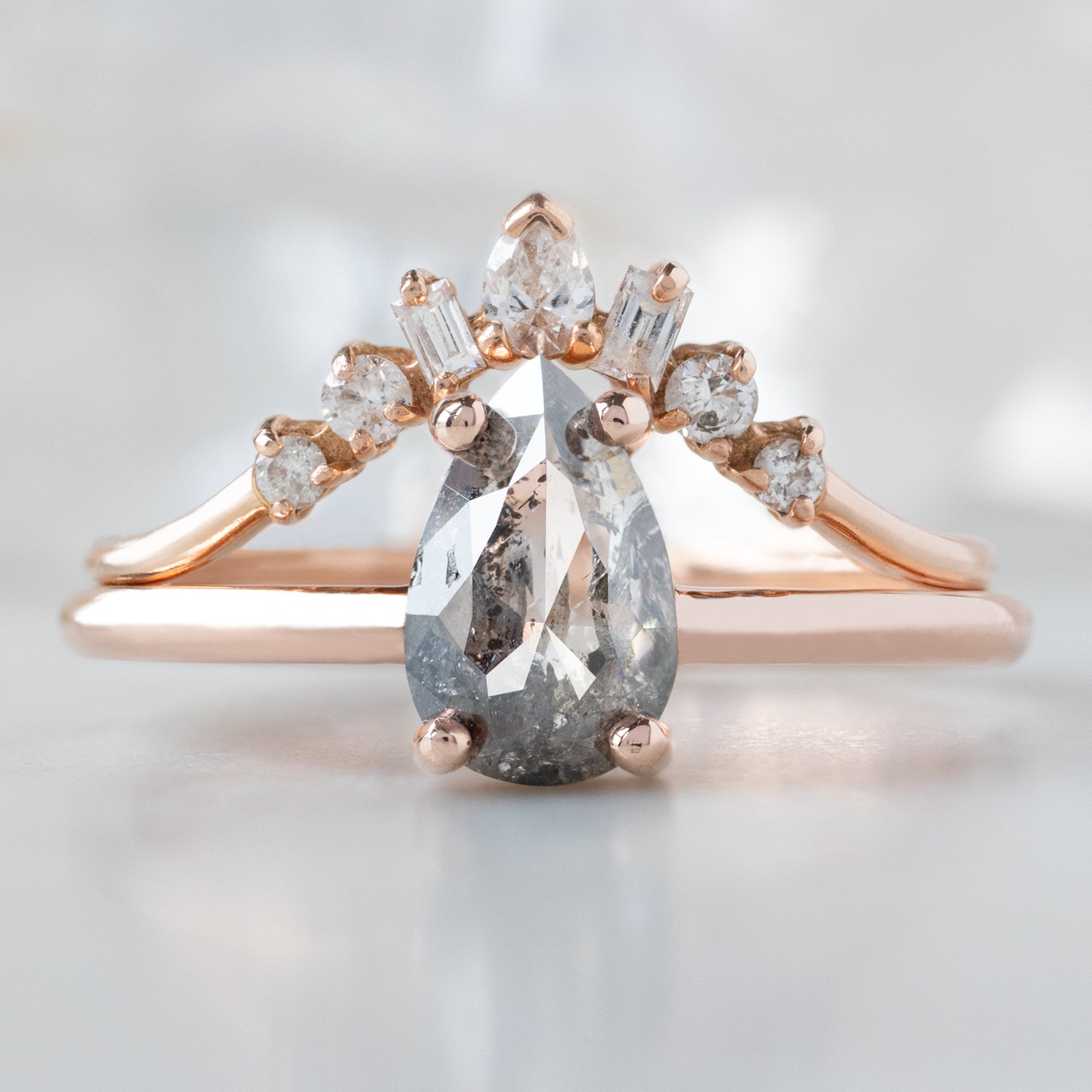 The Bryn Ring with a 0.90ct Pear Salt and Pepper Diamond in 14K Rose Gold Stacked with the Geometric Diamond Sunburst Stacking Band