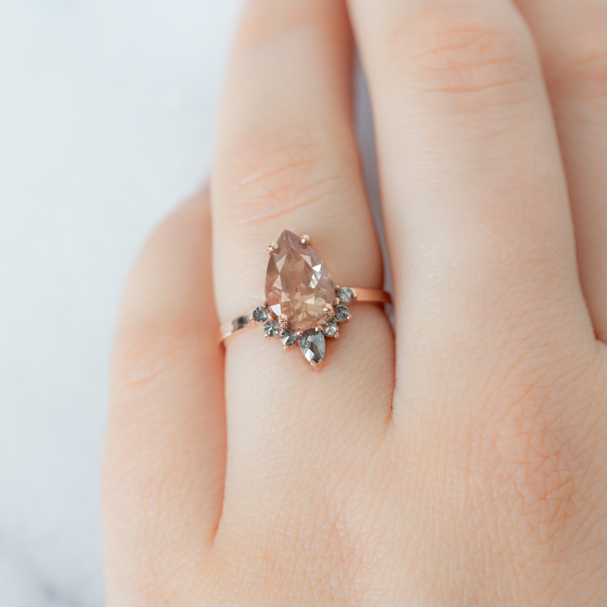 The Aster Ring with a 1.49ct Pear Sunstone in 14K Rose Gold on Model
