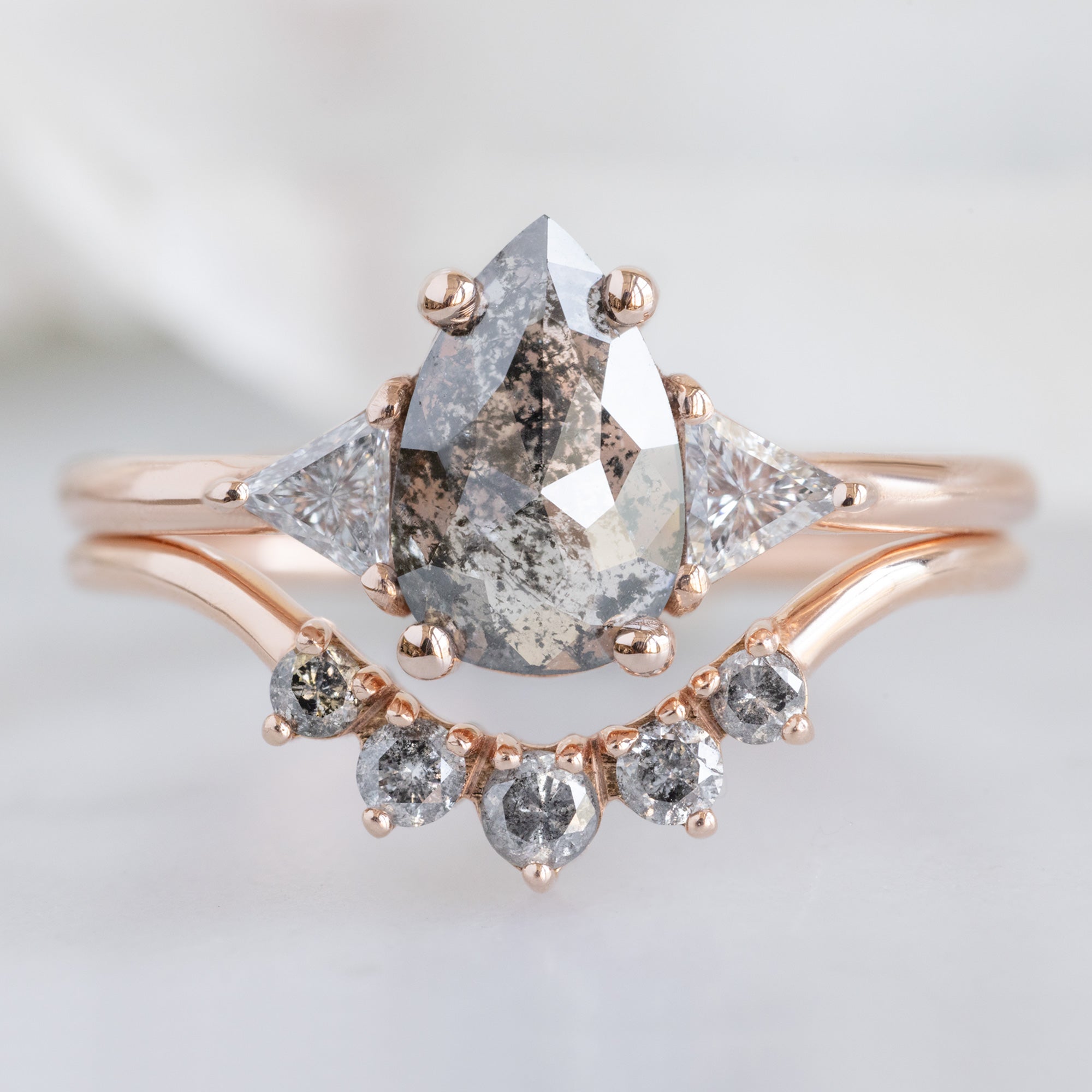 The Jade Ring with a 0.83ct Pear Salt and Pepper Diamond in 14K Rose Gold Stacked with the Round Salt and Pepper Diamond Sunburst Stacking Band