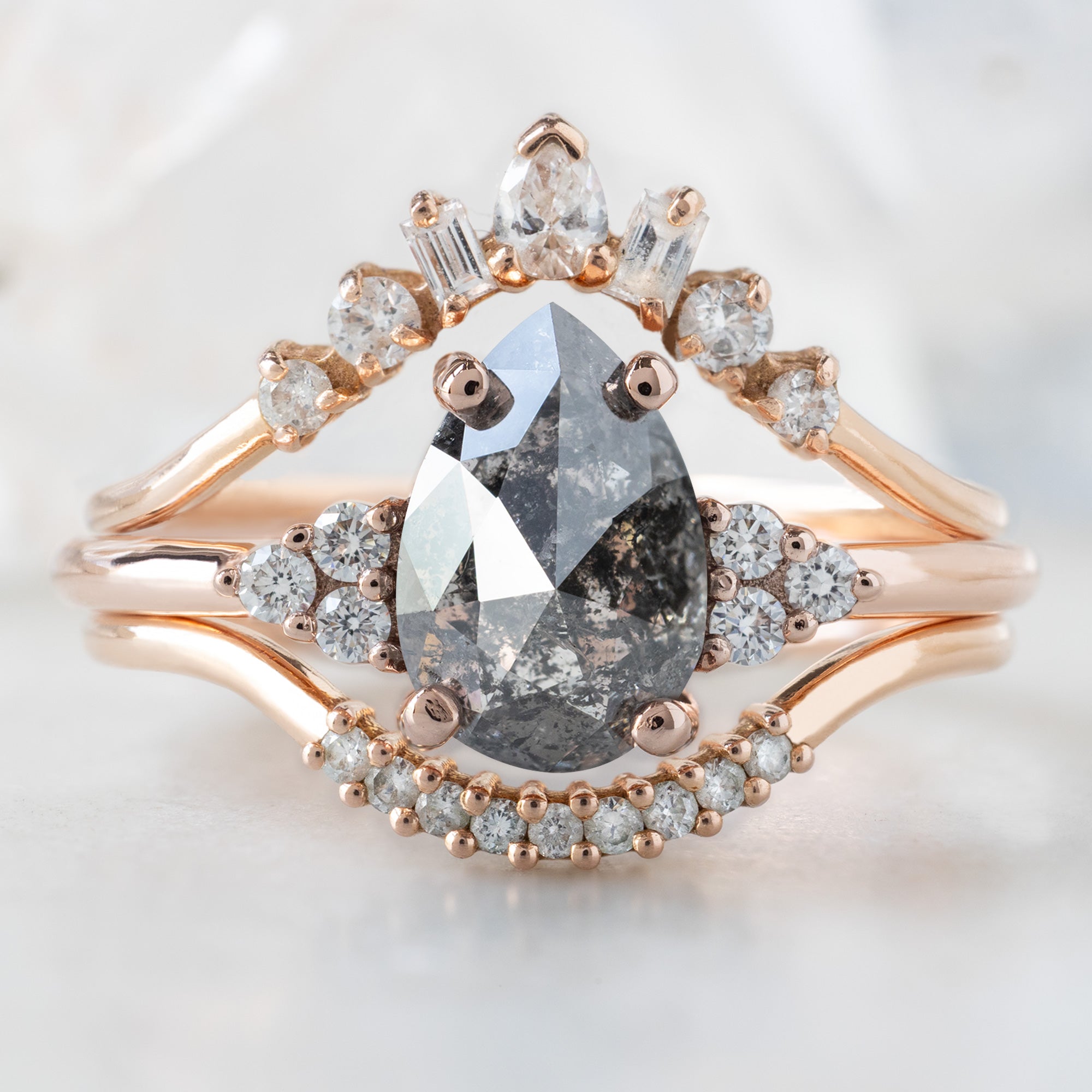 buy:geometric-white-diamond-sunburst-stacking-band-14k-or-18k-yellow-gold,the-ivy-ring-1-54ct-pear-salt-and-pepper-diamond-in-14k-rose-gold,white-diamond-pave-arc-stacking-band-14k-or-18k-yellow-gold