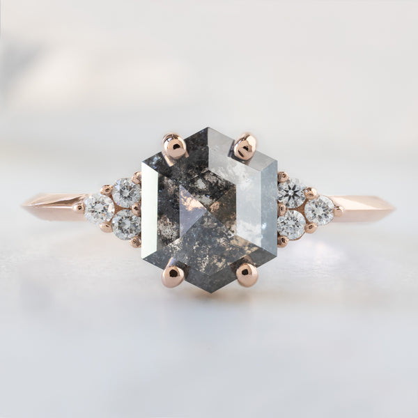 The Ivy Ring with a 1.53ct Hexagon Salt and Pepper Diamond in 14K Rose Gold on White Marble Surface