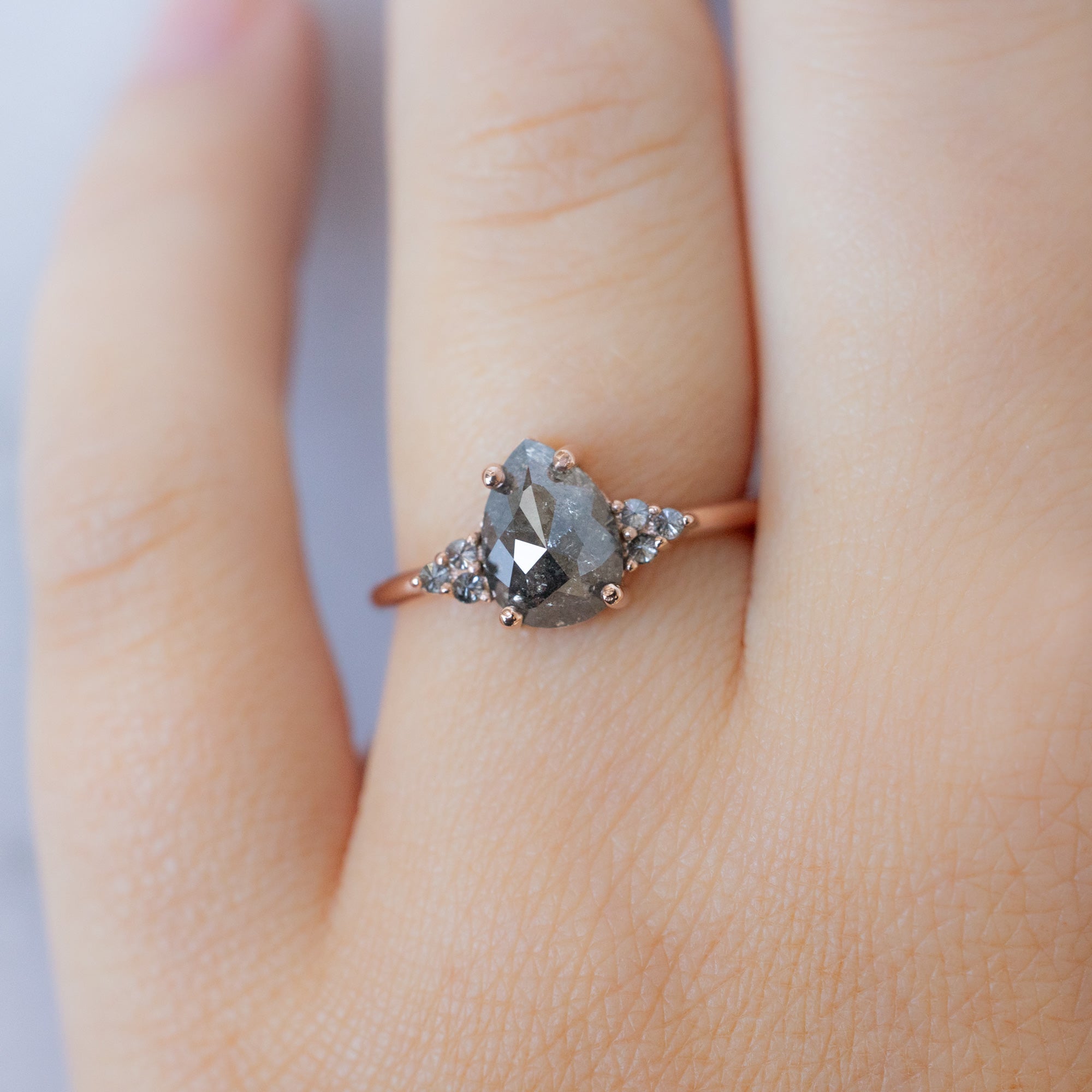 The Ivy Ring with a 1.43ct Pear Salt and Pepper Diamond in 14K Rose Gold on Model