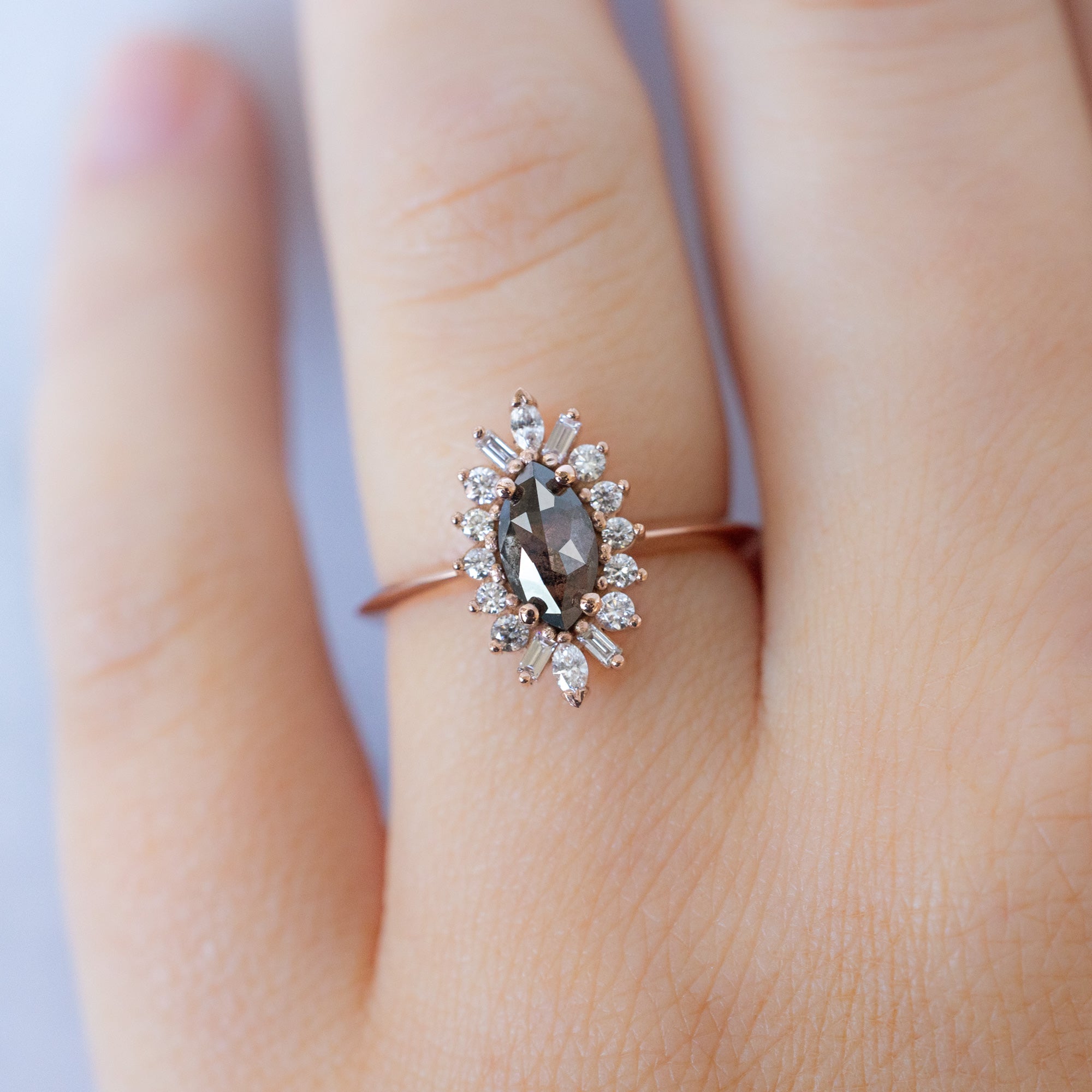 The Camellia Ring with a .66ct Marquise Salt and Pepper Diamond in 14K Rose Gold on Model