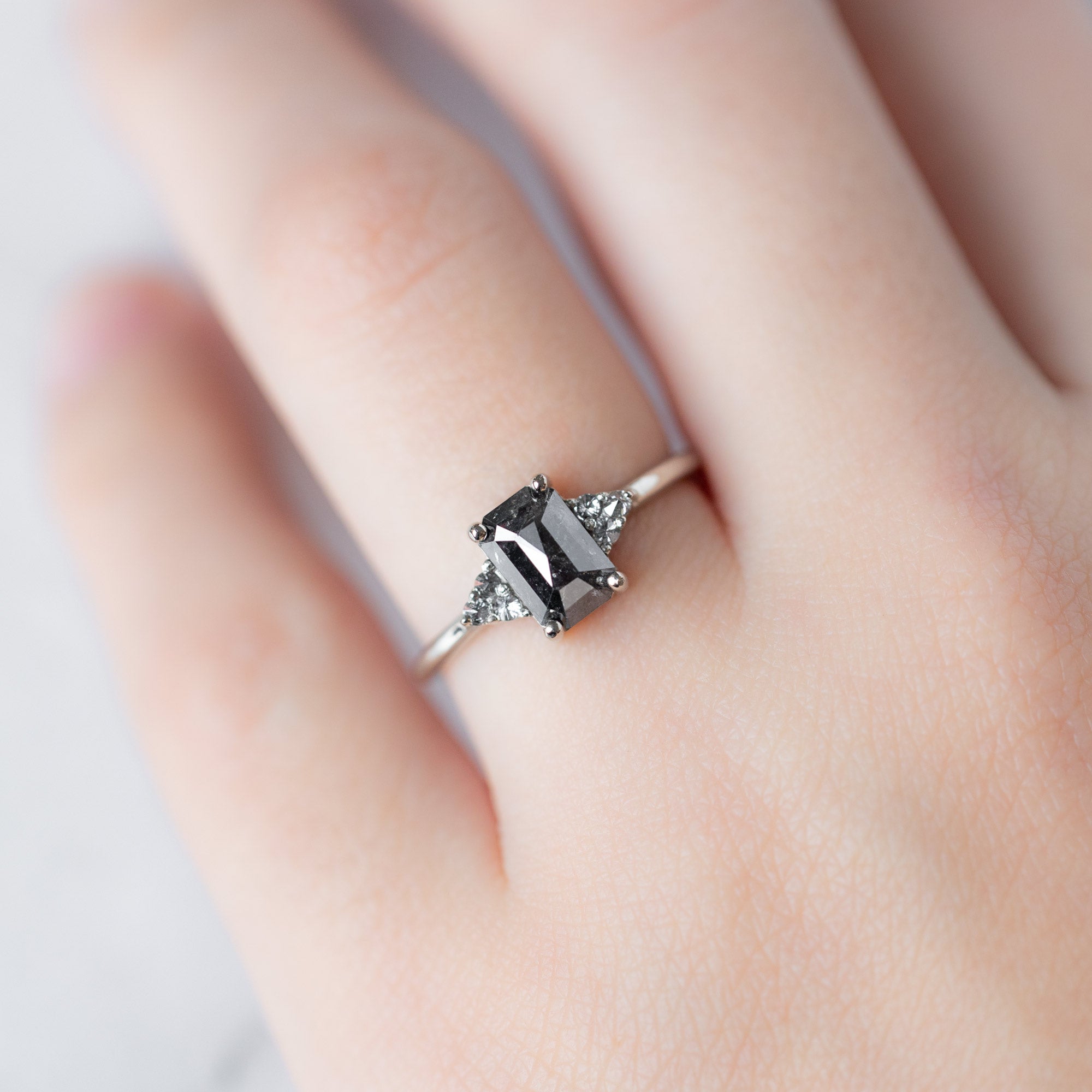 The Ivy Ring with a 1.35ct Emerald Cut Black Diamond in 14K White Gold on model