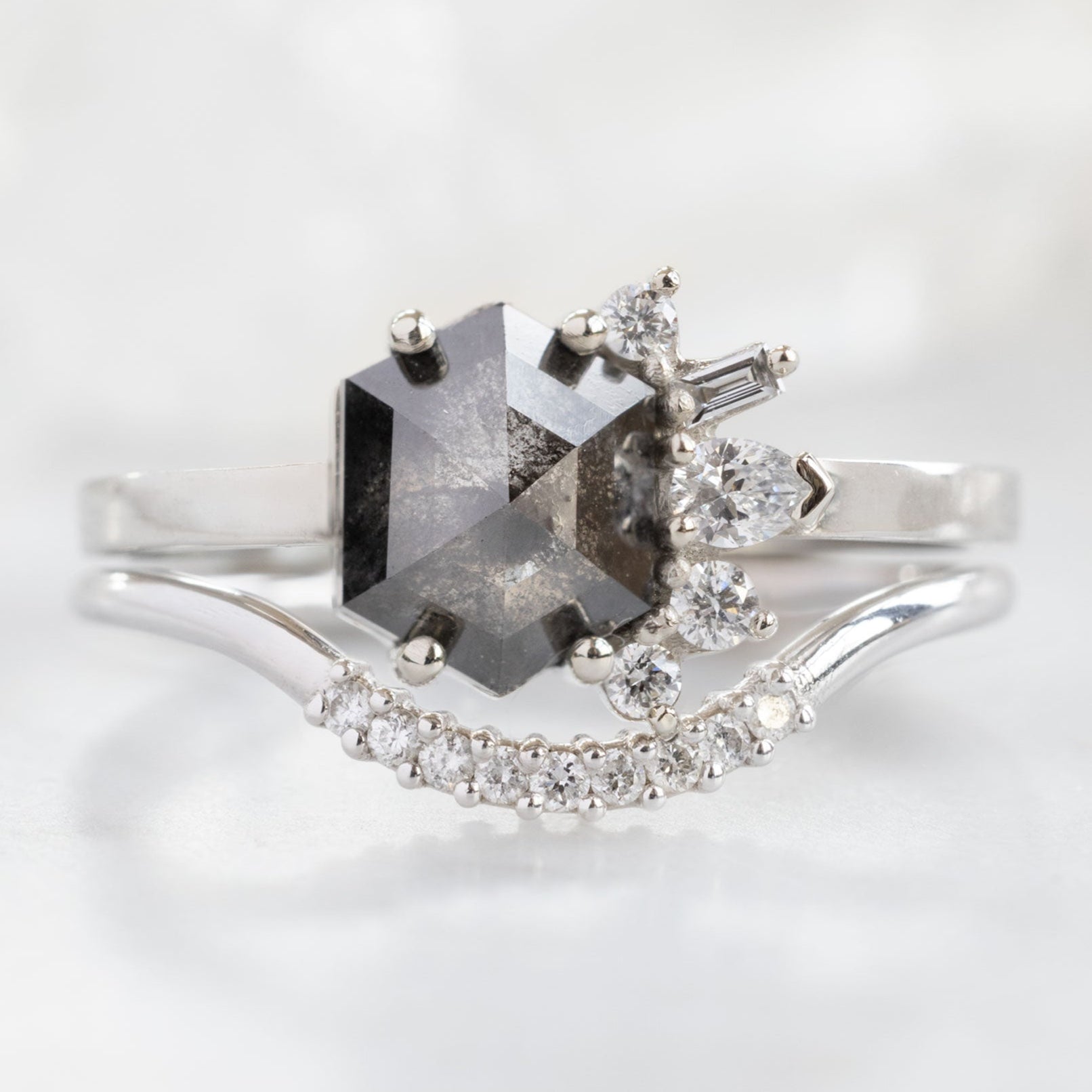 The Cluster Ring with a 1.25ct Hexagon Black Diamond in 14K White Gold Stacked with the White Diamond Pavé Arc Stacking Band