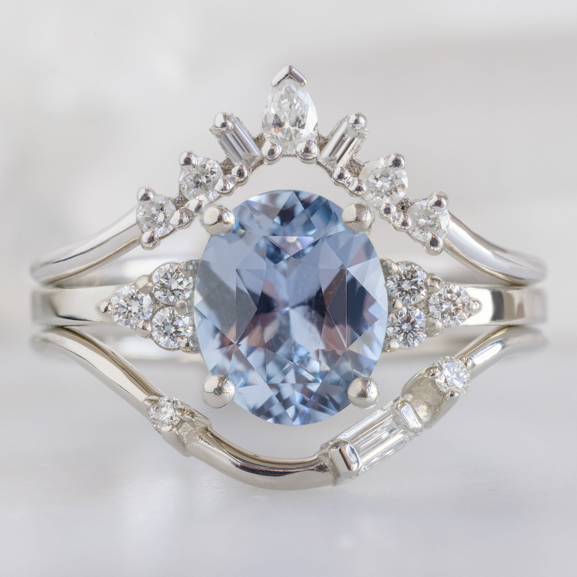 buy:geometric-white-diamond-sunburst-stacking-band-14k-or-18k-yellow-gold,the-ivy-ring-1-65ct-oval-purple-sapphire-in-14k-white-gold,asymmetrical-baguette-diamond-arc-stacking-band-in-14k-yellow-gold