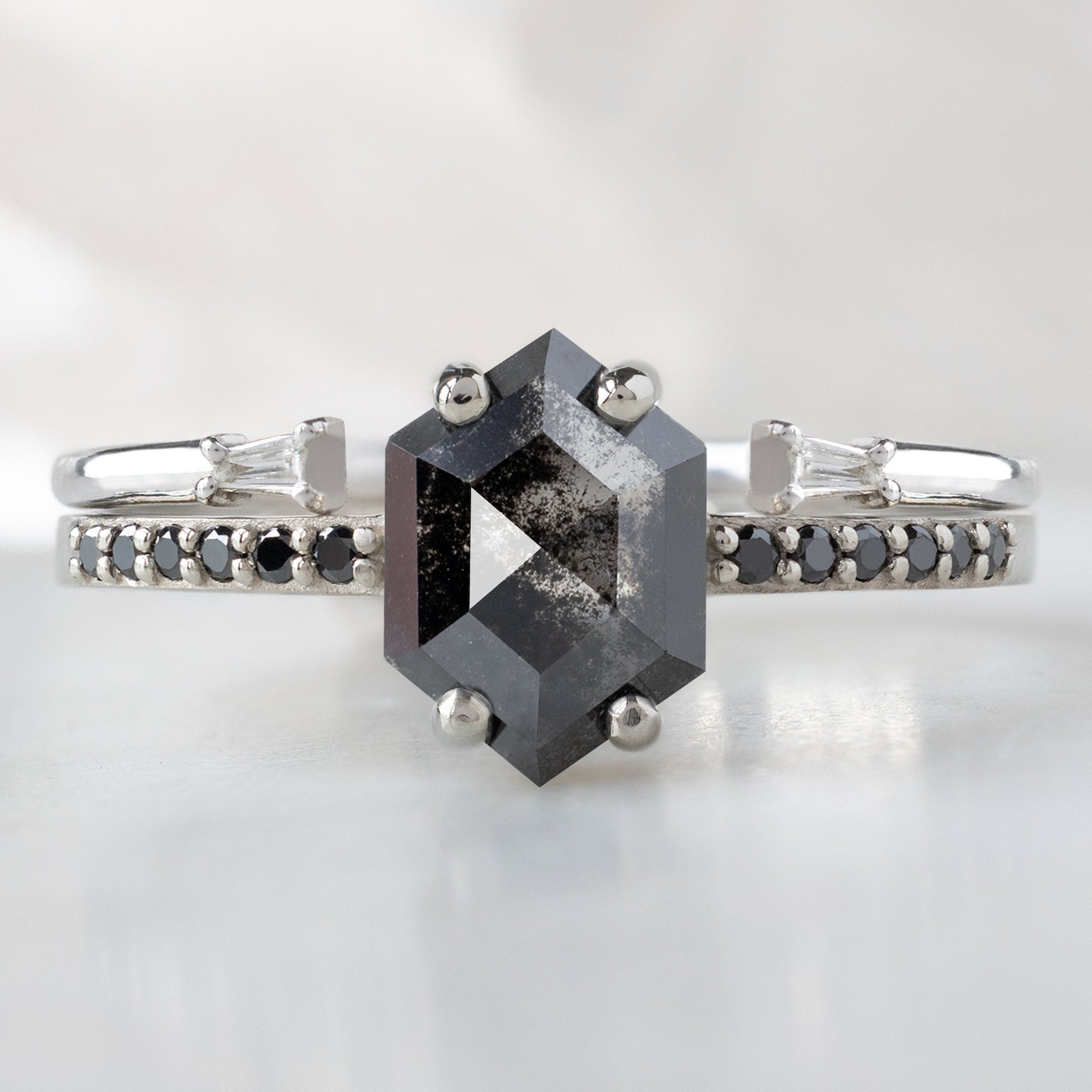 The Willow Ring with a 0.89ct Hexagon Black Diamond in 14K White Gold Stacked with the Open Cuff Diamond Baguette Stacking Band