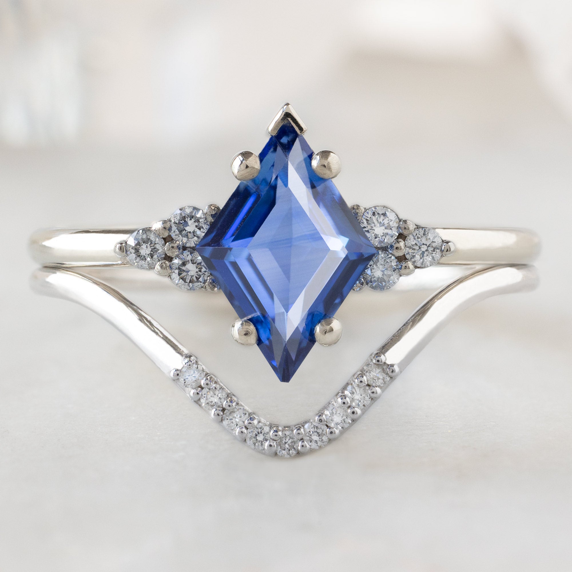The Ivy Ring with a 1.04ct Kite Blue Sapphire in 14K White Gold Stacked with the White Diamond Pavé Stacking Band