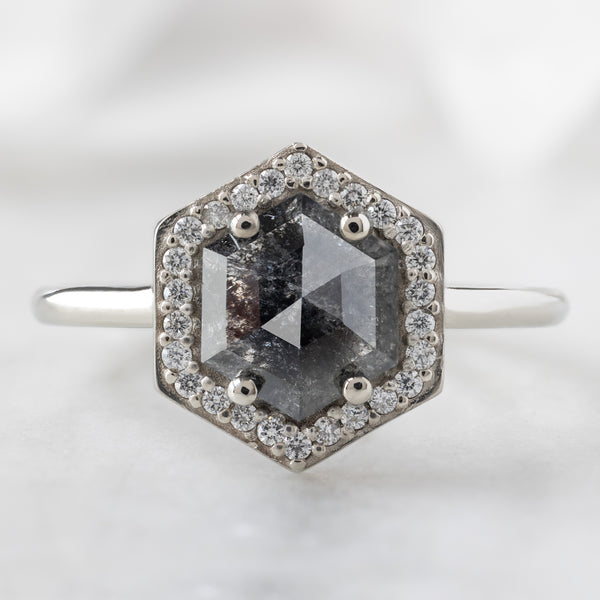 The Dahlia Ring with a 1.08ct Hexagon Black Diamond in 14K White Gold on White Marble