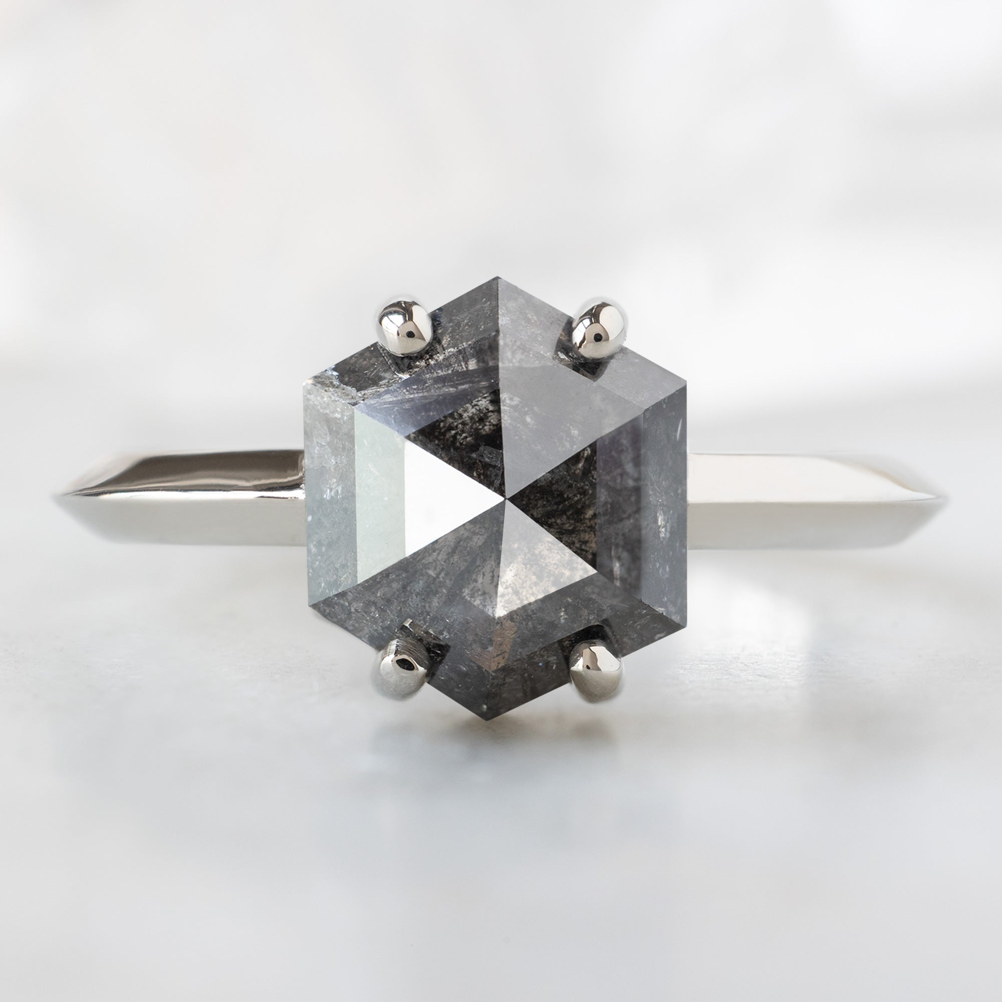The Bryn Ring with a 1.85ct Hexagon Salt and Pepper Diamond in 14K White Gold on White Marble