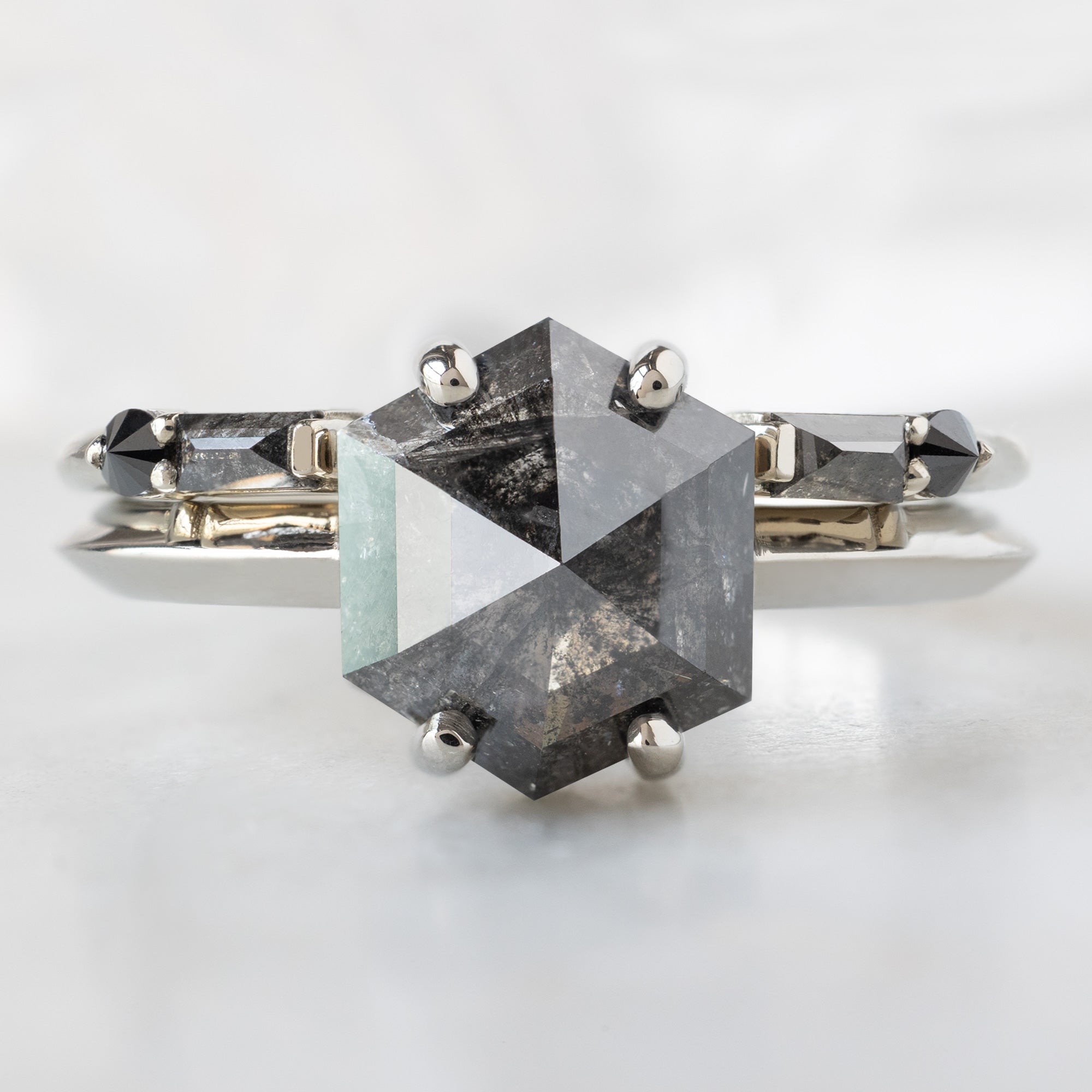 The Bryn Ring with a 1.85ct Hexagon Salt and Pepper Diamond in 14K White Gold Stacked with the Luxe Open Cuff Black Baguette Stacking Band