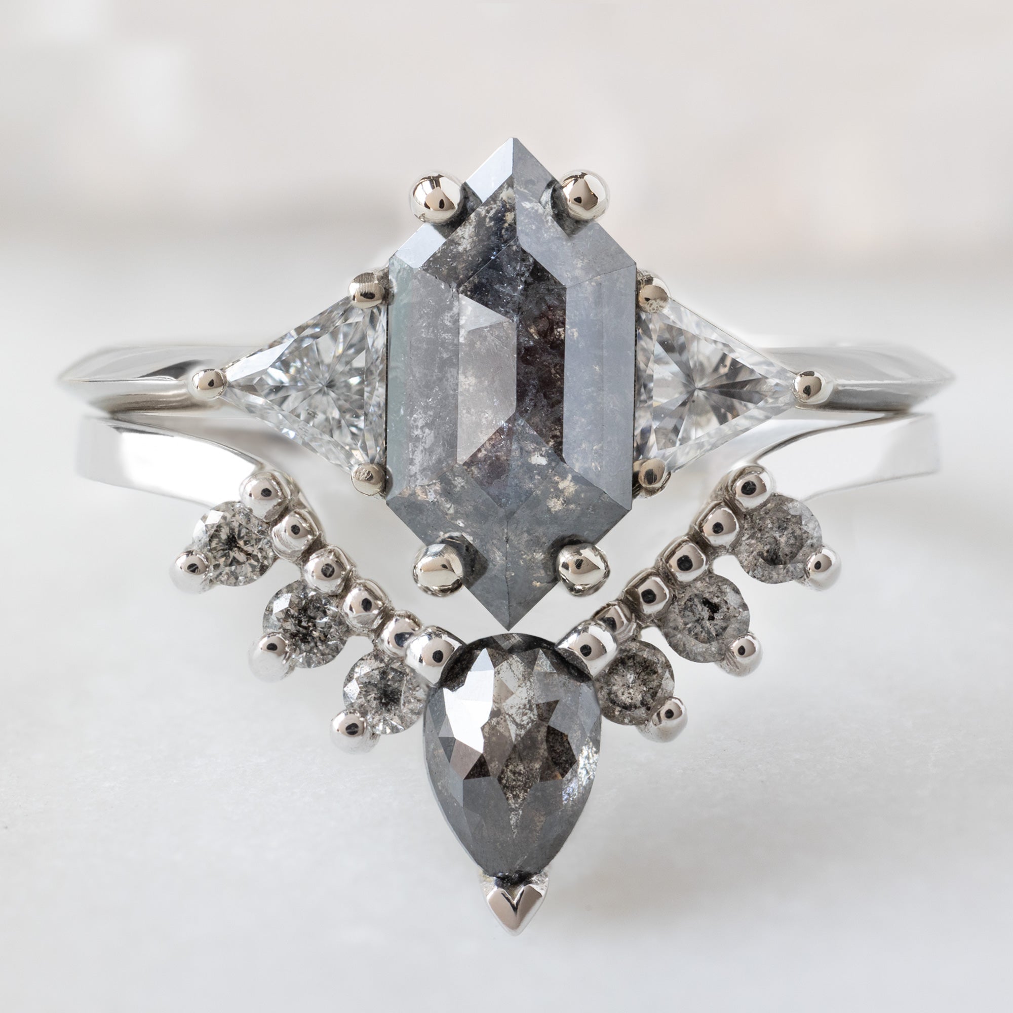 The Jade Ring with a 1.02ct Hexagon Black Diamond in 14K White Gold Stacked with the Black and Salt and Pepper Diamond Sunburst Stacking Band