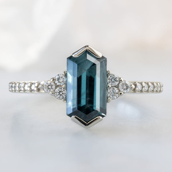 The Ivy Ring with a 1.22ct Hexagon Blue Spinel in 14K White Gold on White Marble Surface