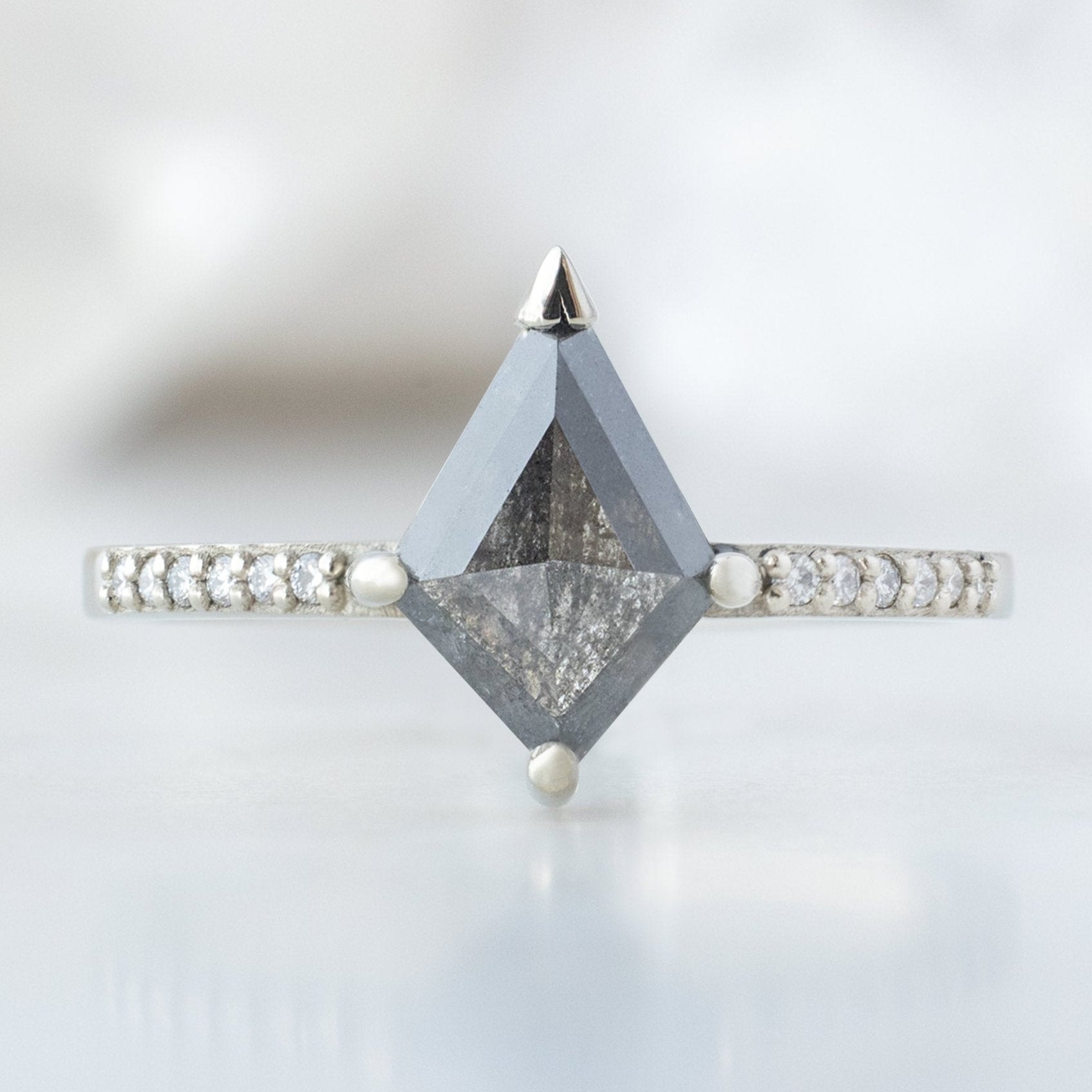 The Willow Ring with a 1.19ct Kite Salt and Pepper Diamond in 18K White Gold on White Marble