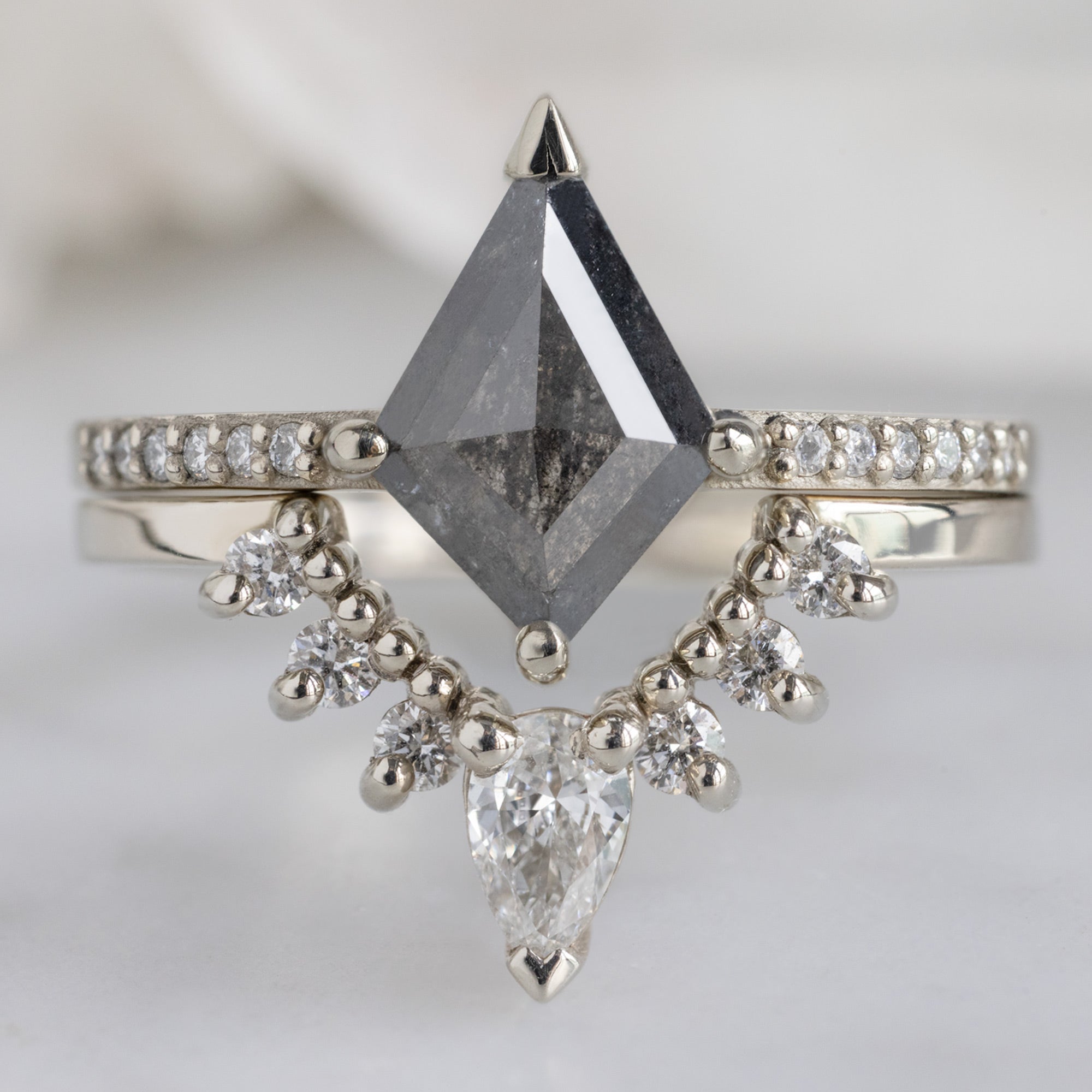 The Willow Ring with a 1.19ct Kite Salt and Pepper Diamond in 18K White Gold Stacked with White Diamond Sunburst Stacking Band