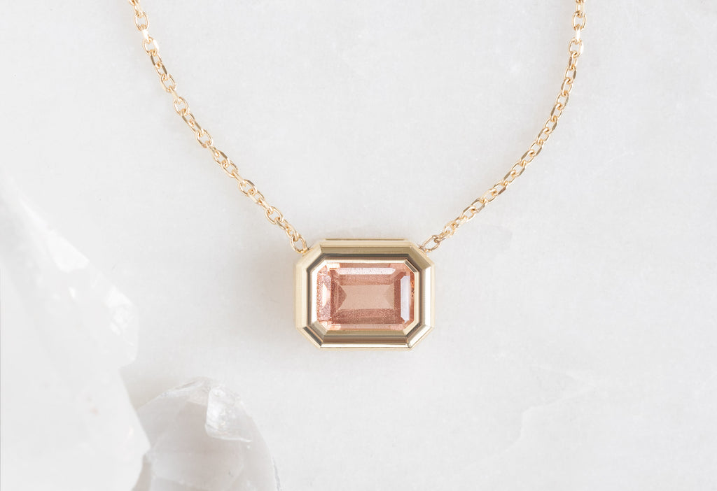 Emerald-Cut Sunstone Necklace on White Marble