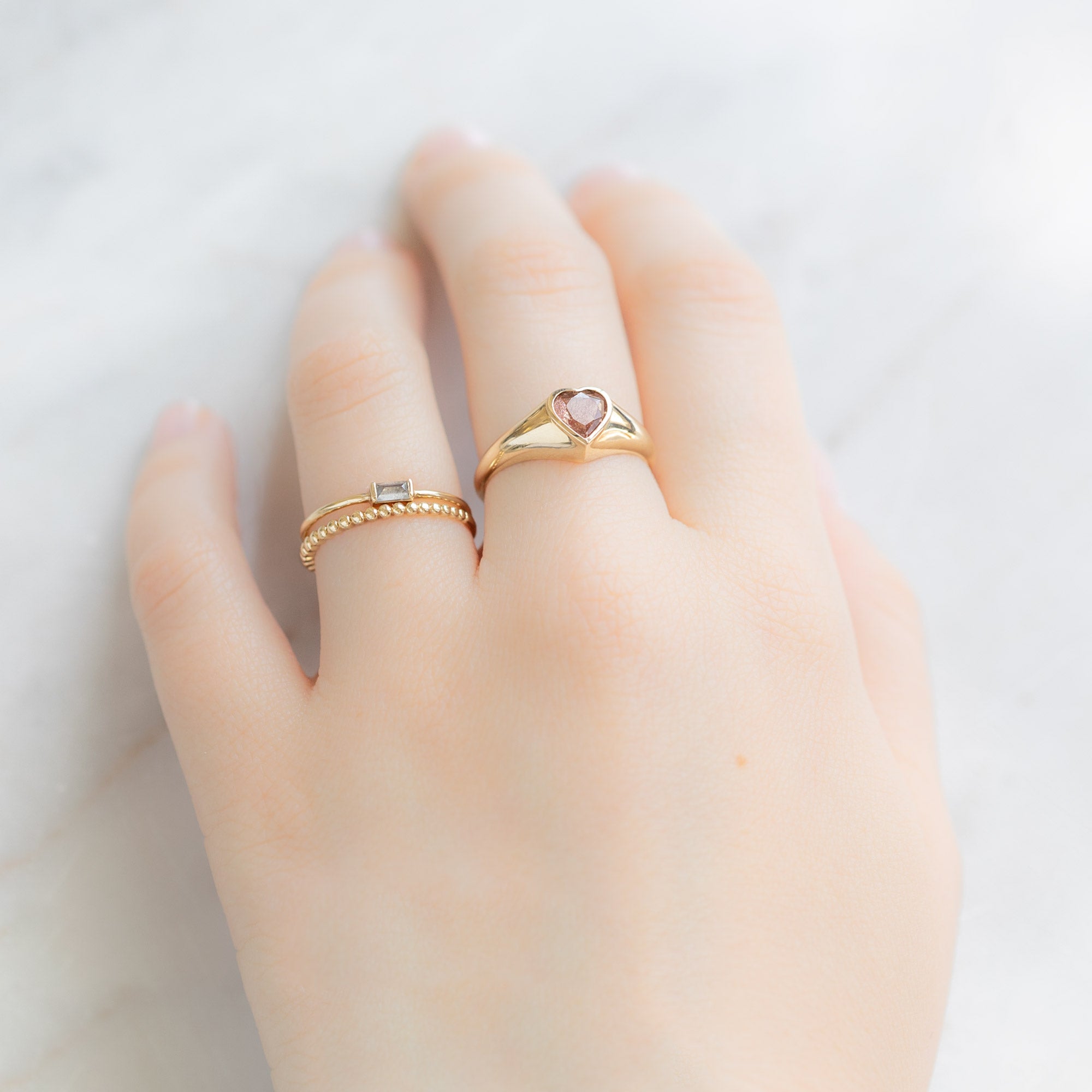 buy:the-baguette-white-diamond-line-ring-10k-yellow-gold,the-gold-beaded-stacking-ring-14k-yellow-gold,the-sweetheart-sunstone-signet-ring-10k-yellow-gold