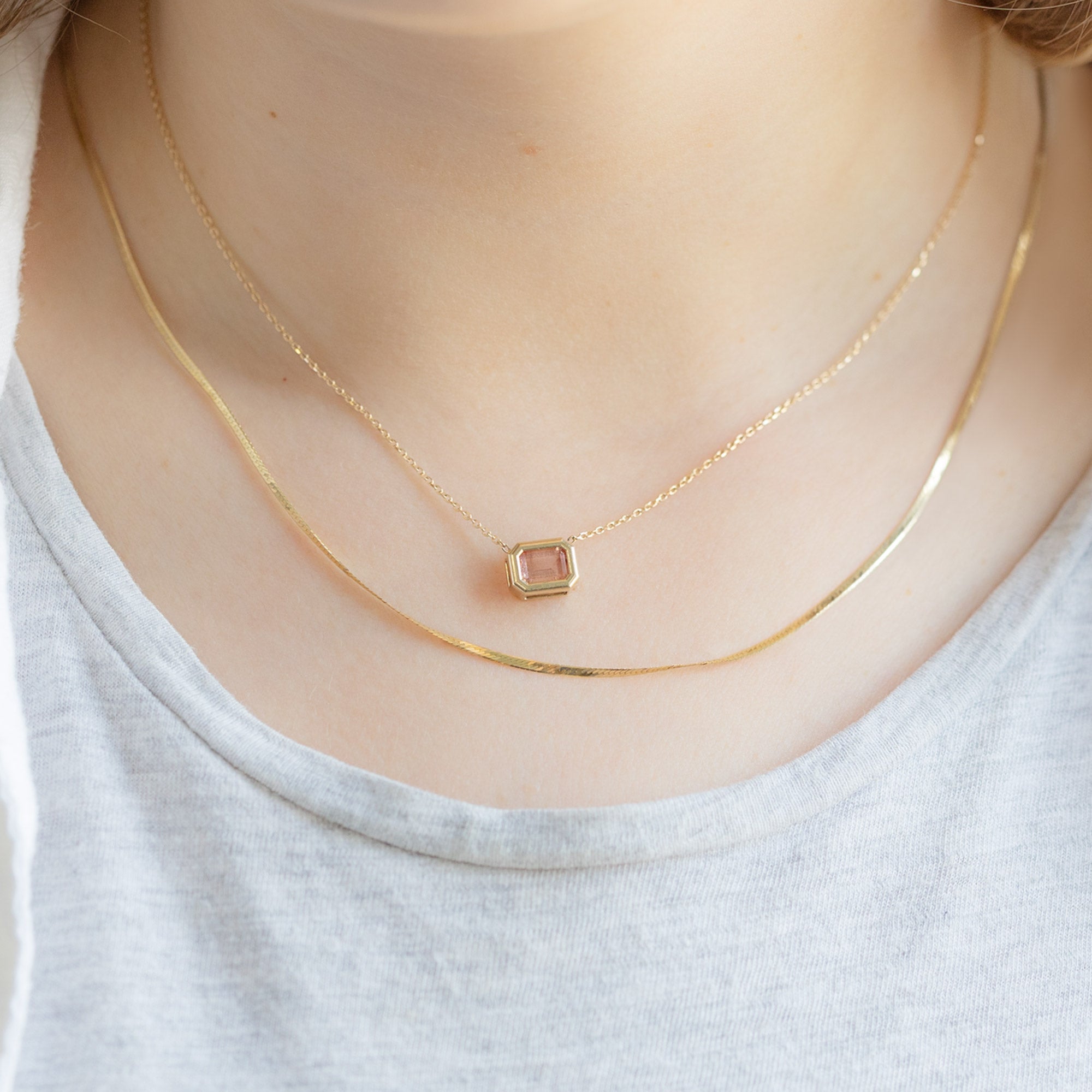 buy:the-herringbone-chain-necklace-14k-yellow-gold,the-emerald-cut-sunstone-necklace-10k-yellow-gold