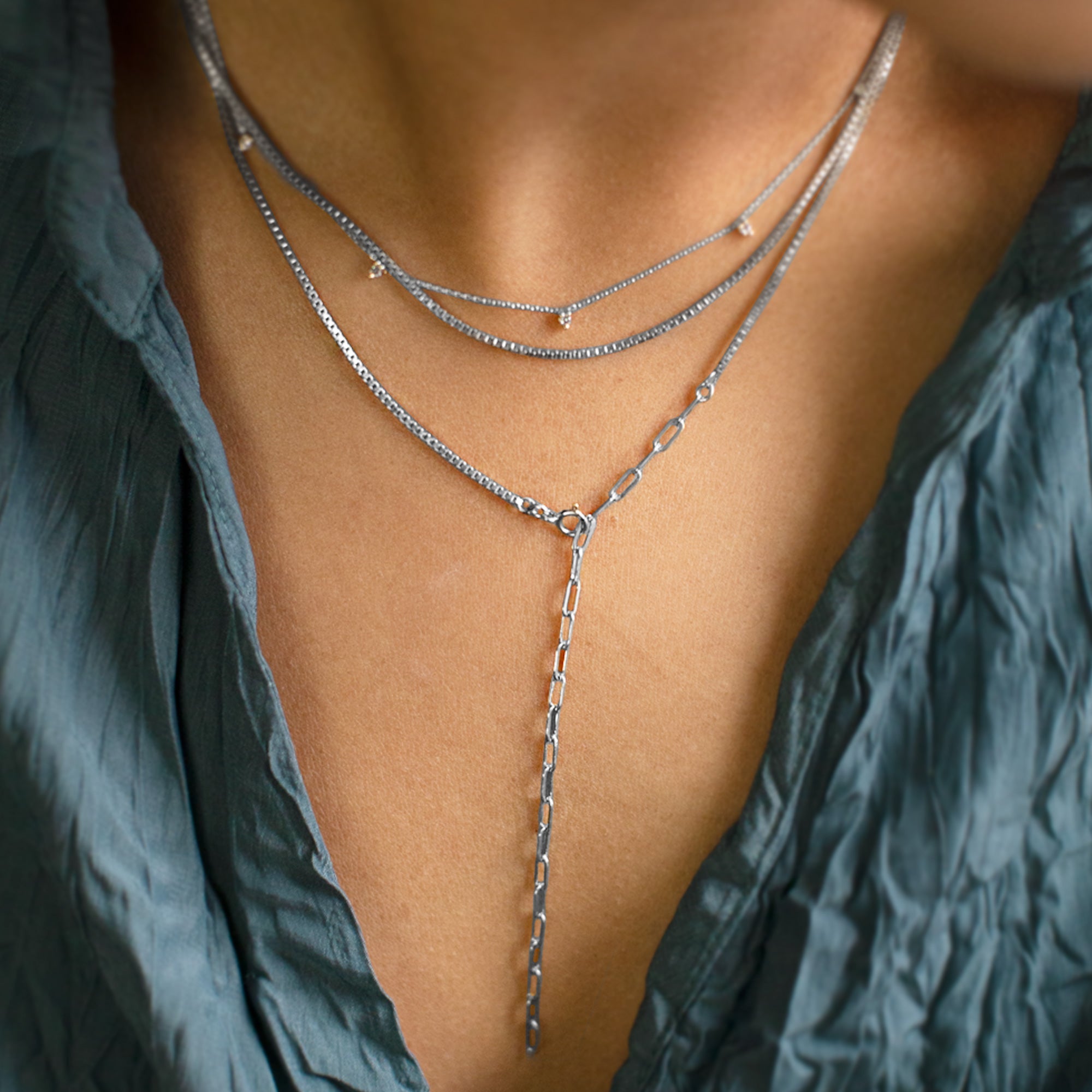 The 4-in-1 Cable Chain Necklace in 14K White Gold Stacked on Model