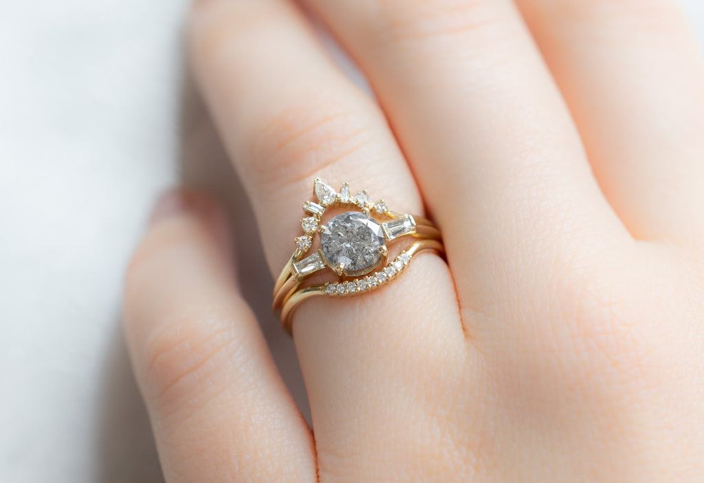 The Ash Ring with a Round Salt and Pepper Diamond with White Diamond Stacking Bands on Model