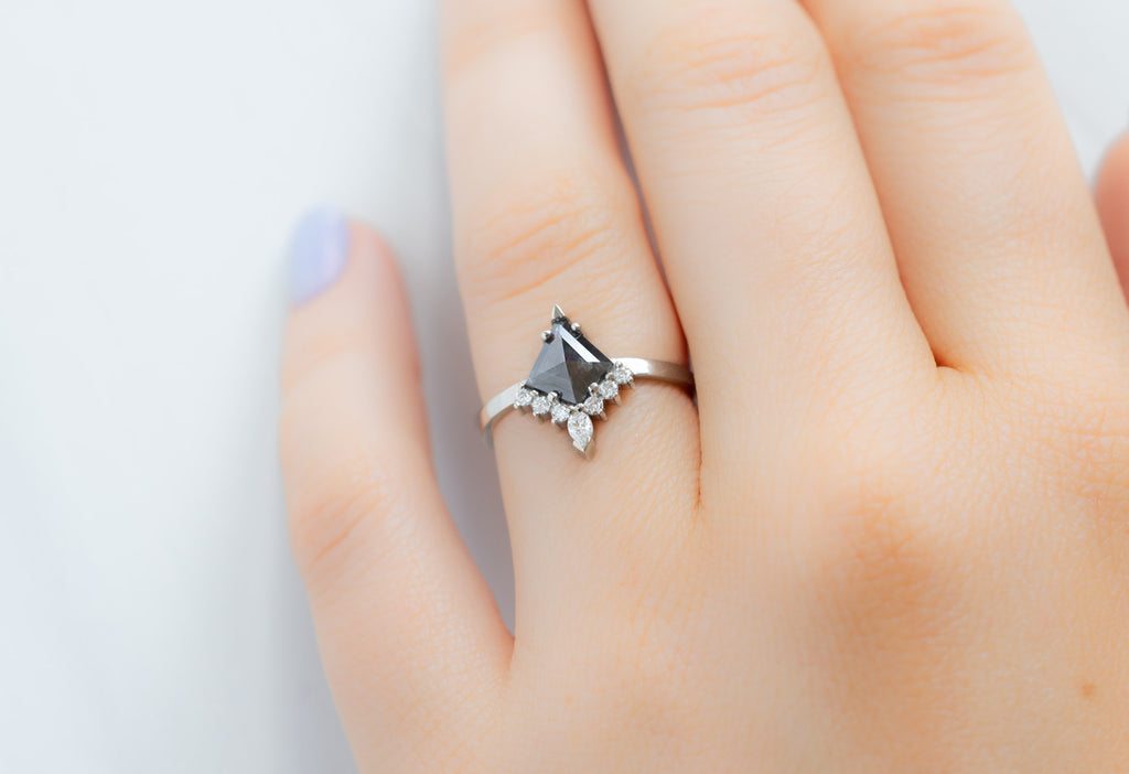 The Aster Ring with a Black Kite-Shaped Diamond on Model