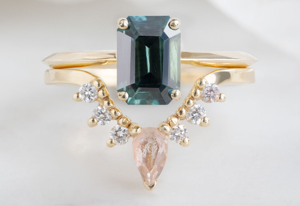 The Bryn Ring with an Emerald-Cut Sapphire with Sunstone and White Diamond Sunburst Stacking Band