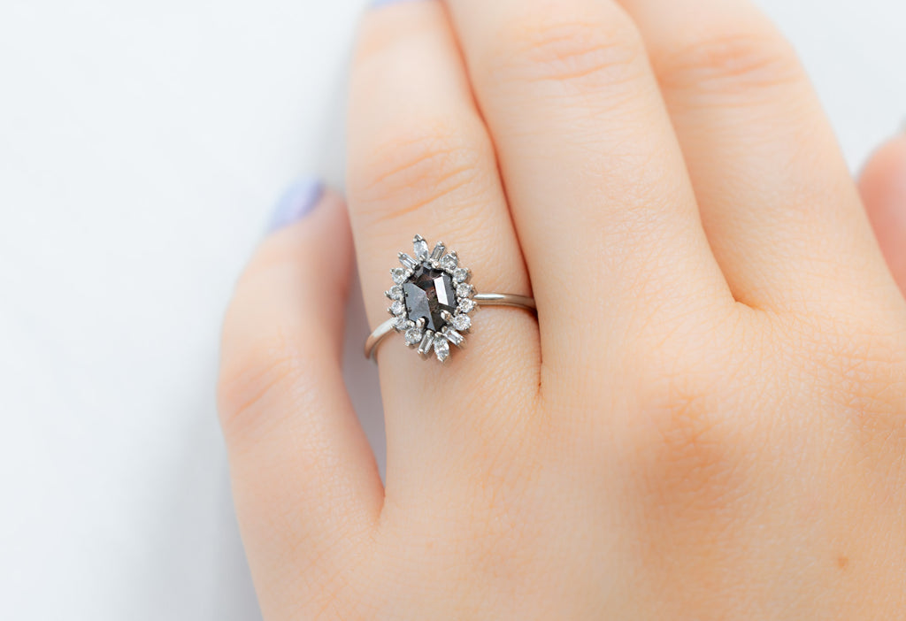 The Camellia Ring with a Black Hexagon Diamond on Model