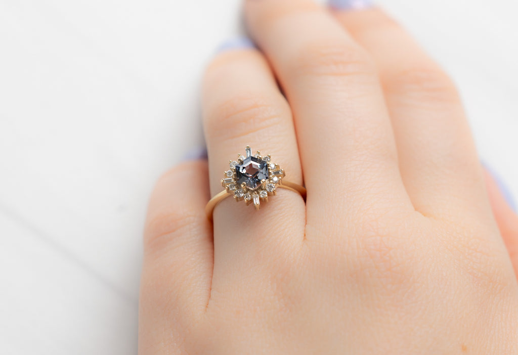 The Compass Ring with a Violet Grey Spinel on Model