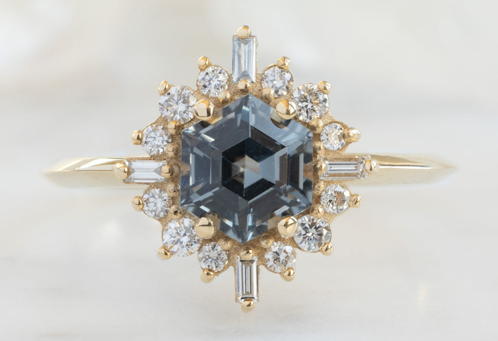 The Compass Ring with a Violet Grey Spinel