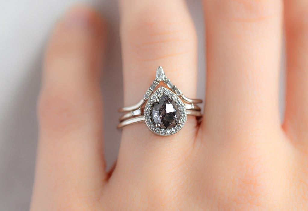 The Dahlia Ring with a Rose-Cut Black Diamond with White Diamond Stacking Bands on Model