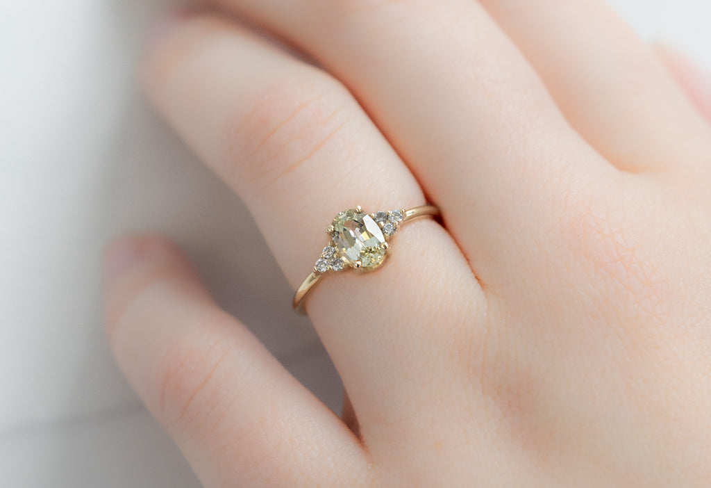 The Ivy Ring with an Oval-Cut Yellow Sapphire on Model
