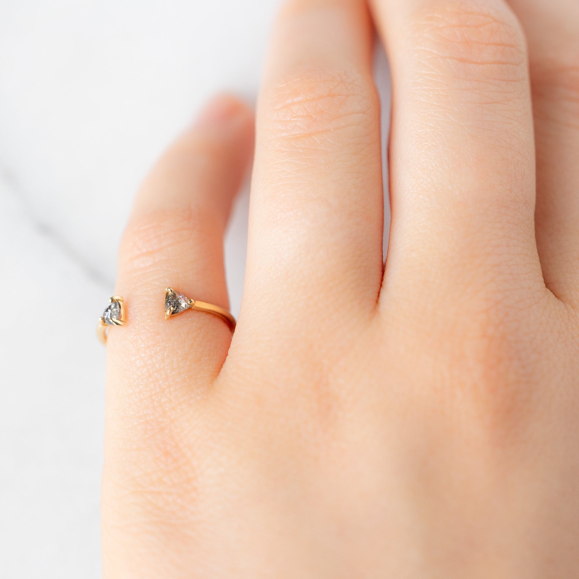 Open Cuff Salt and Pepper Diamond Trillion Stacking Band in Yellow Gold on Model's pinky finger