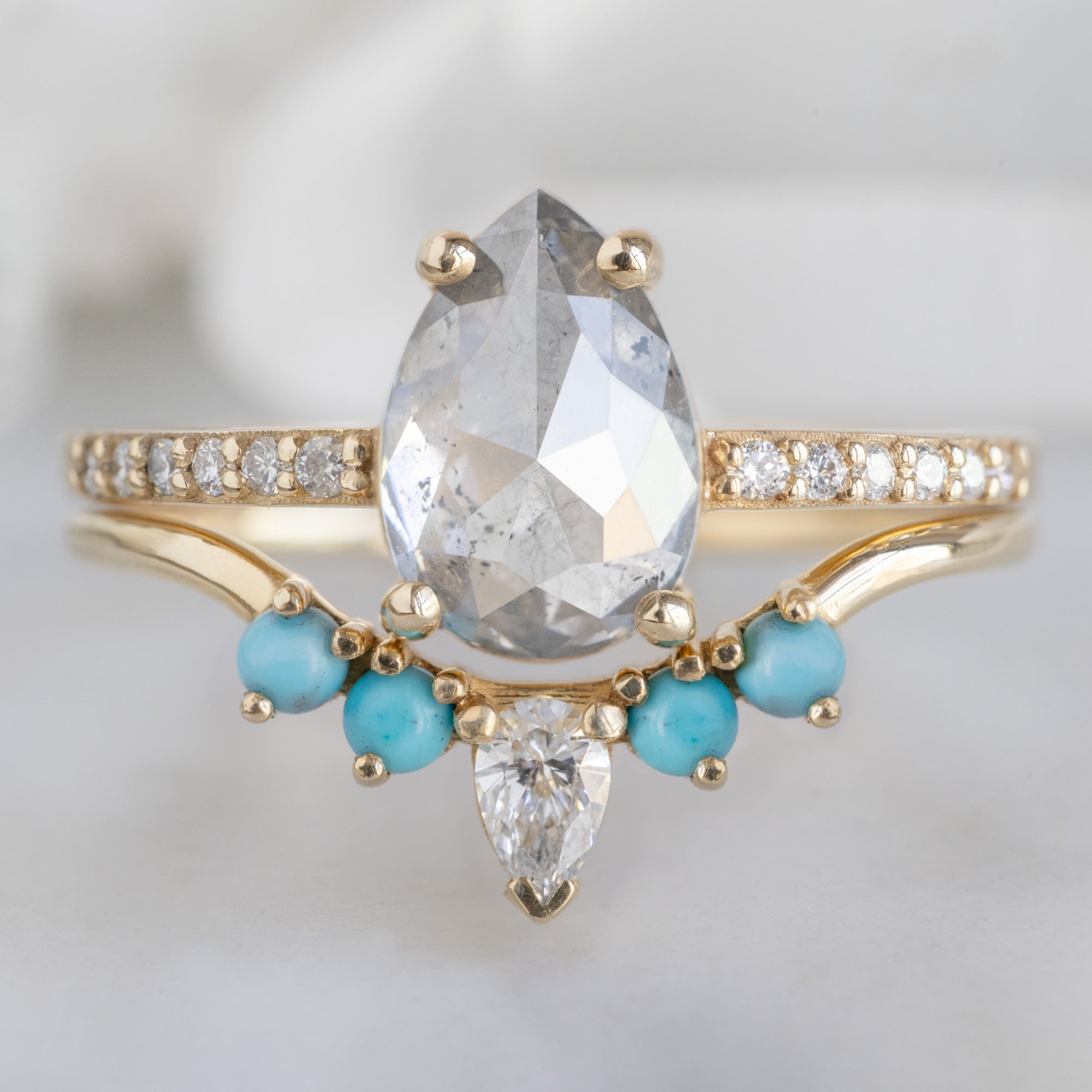 White Diamond and Turquoise 4-Stone Sunburst Stacking Band in 14K Yellow Gold Stacked with Salt and Pepper Pear Diamond Engagement Ring
