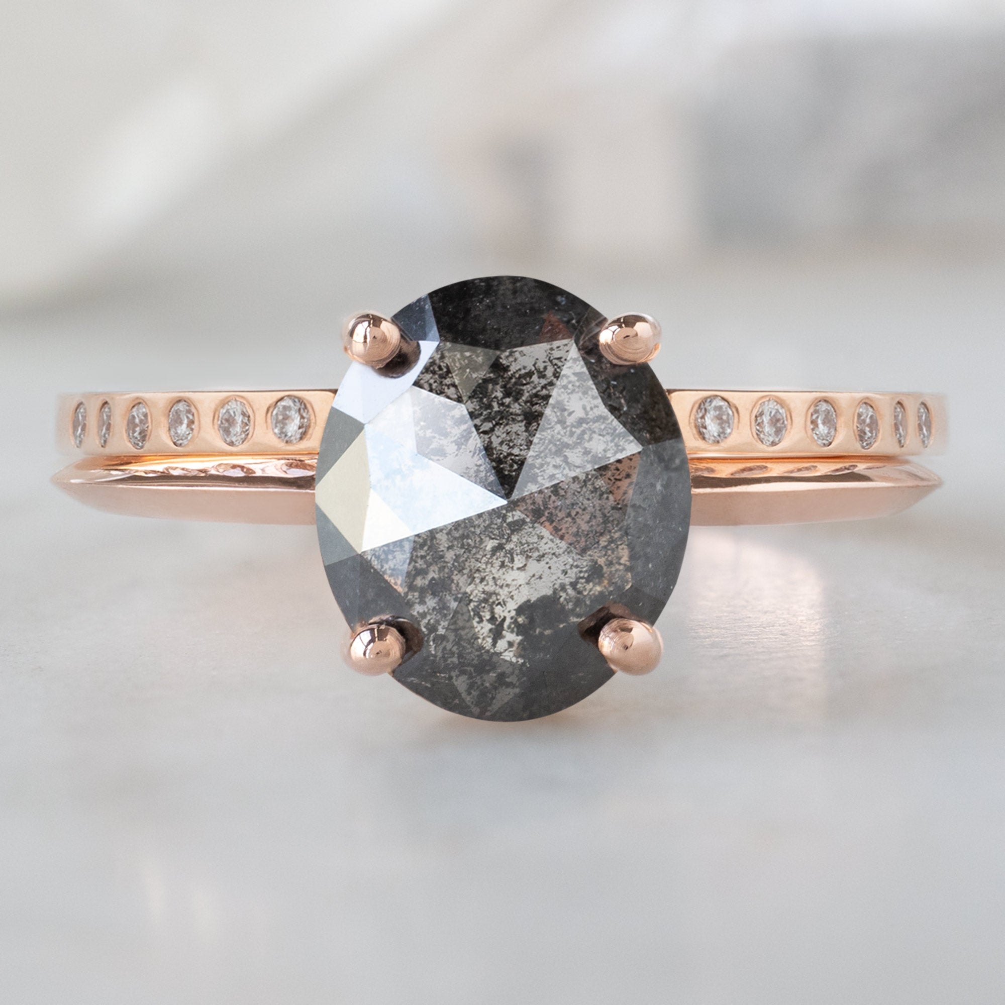 Open Cuff Flush Set Salt and Pepper Diamond Pavé Stacking Band in 14k Rose Gold Stacked with Oval Diamond Engagement Ring